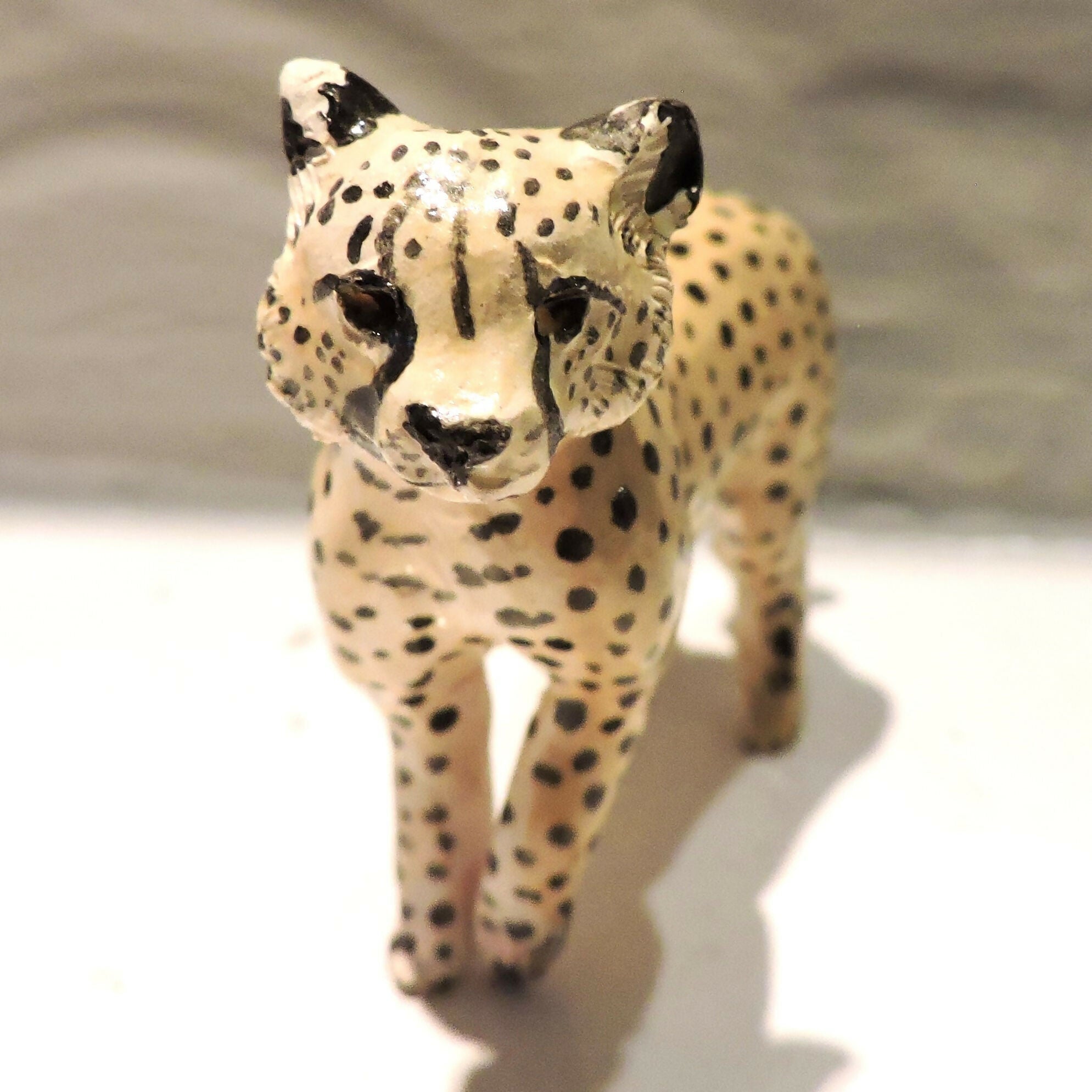 Ceramic cheetah sculpture