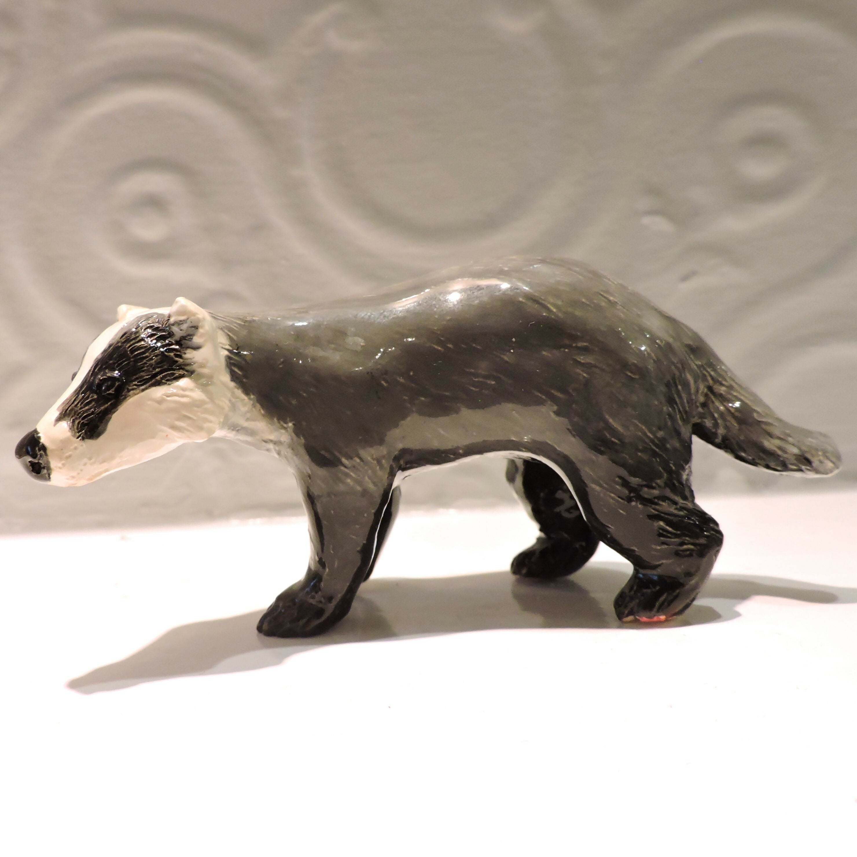 Ceramic Badger sculpture, prowling