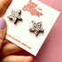 Large_black_white_and_pink_leopard_print_star_studs_close_up