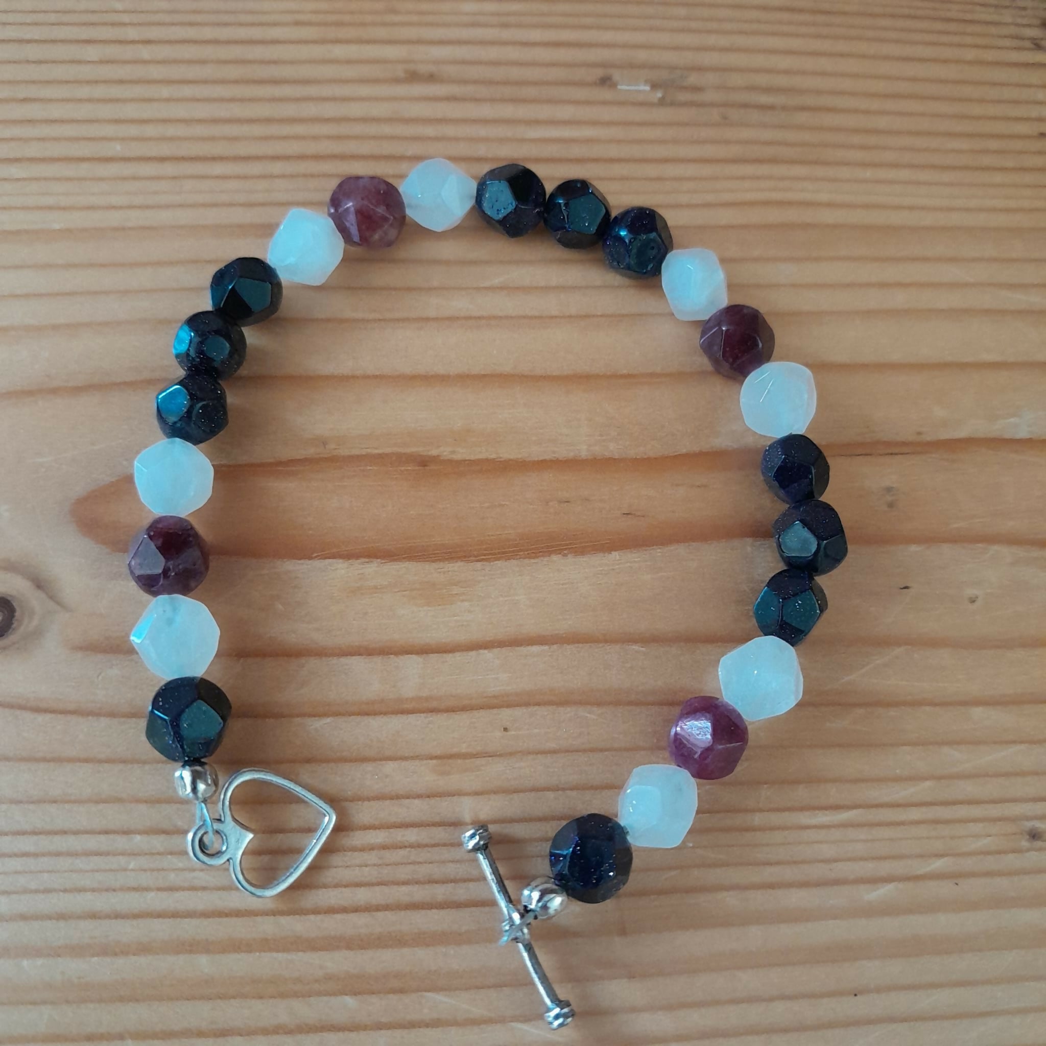 Tibetan Silver Toggle Catch Bracelet with Faceted Navy Goldstone, Faceted Rose Quartz and Faceted Indian Agate.