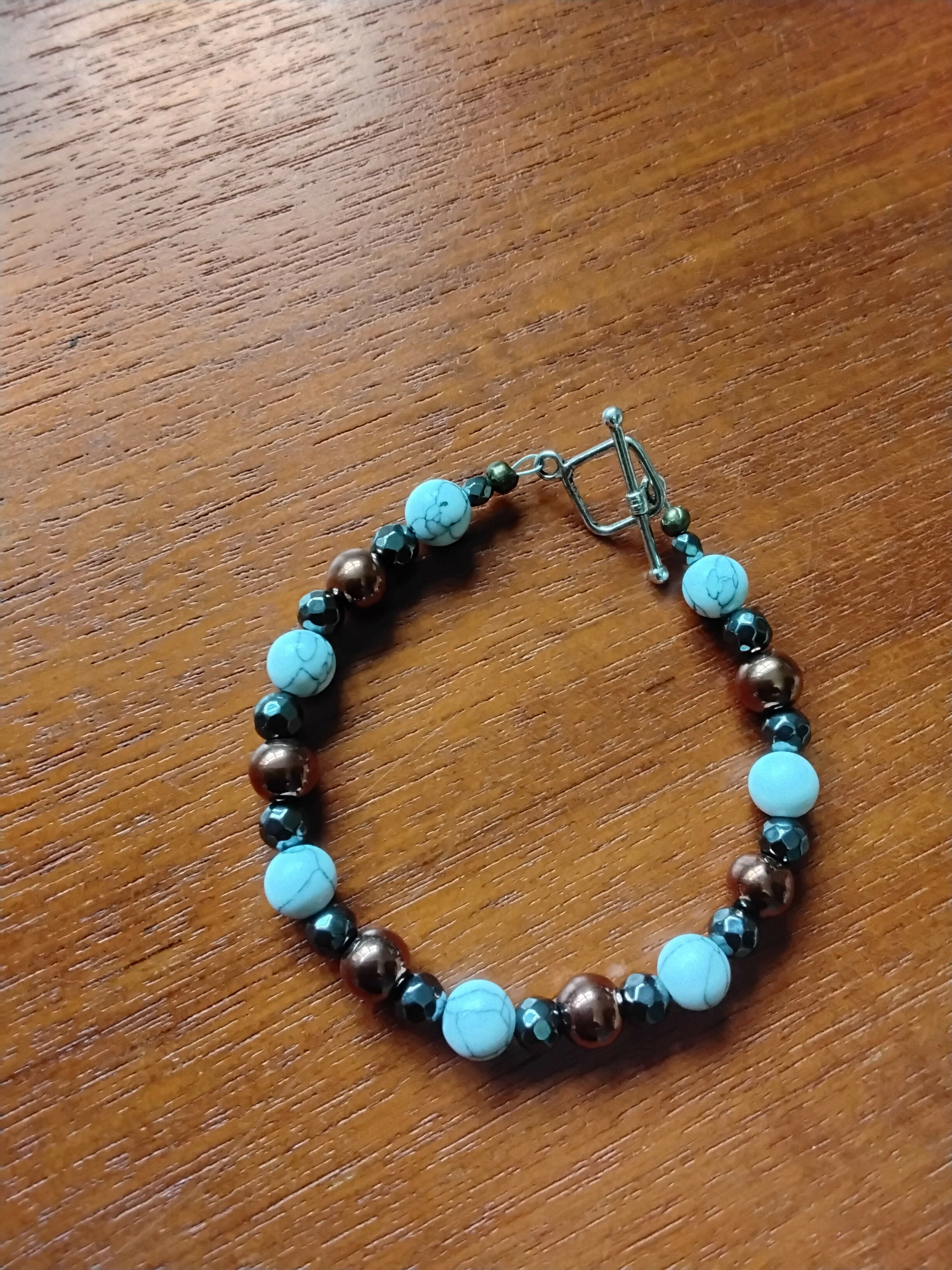 Tibetan Silver Toggle Catch Bracelet with Howlite, Faceted Grey Hematite & Copper Hematite.