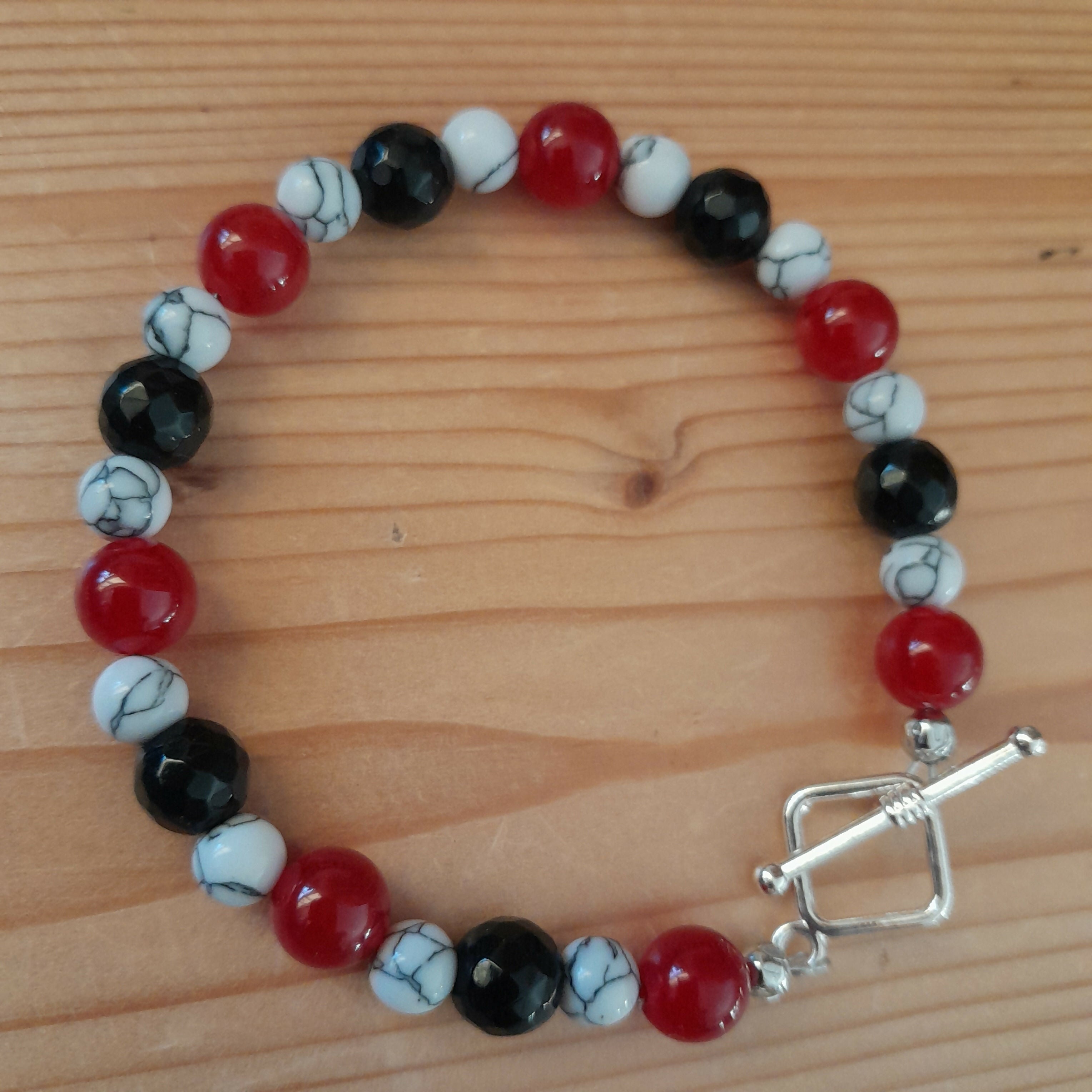 Tibetan Silver toggle Catch Bracelet with Red Chalcedony, Grey Veined Howlite & Black Faceted Onyx.