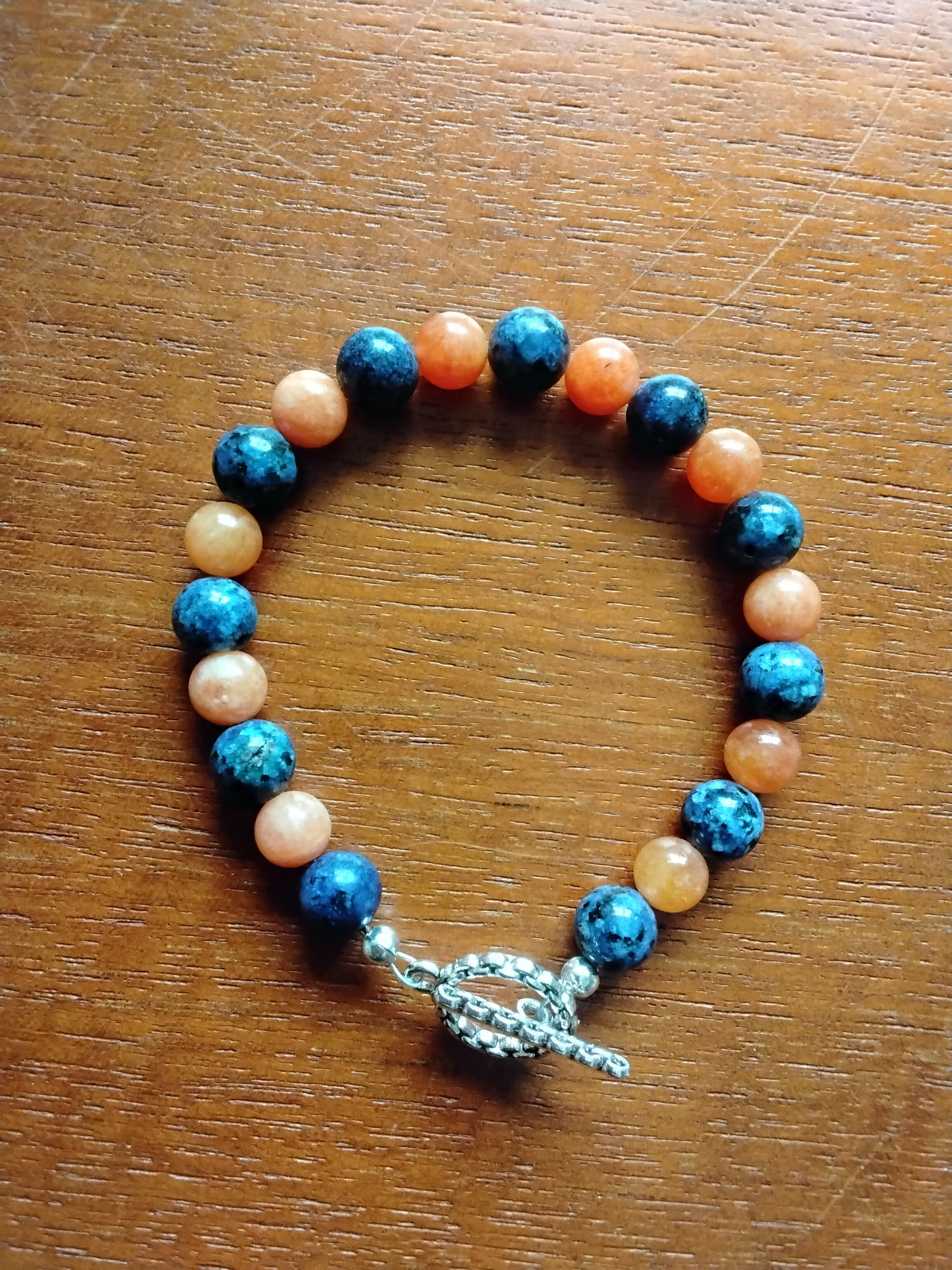 Tibetan Silver toggle Catch Bracelet with Blue Spot Jasper & Orange Chalcedony.