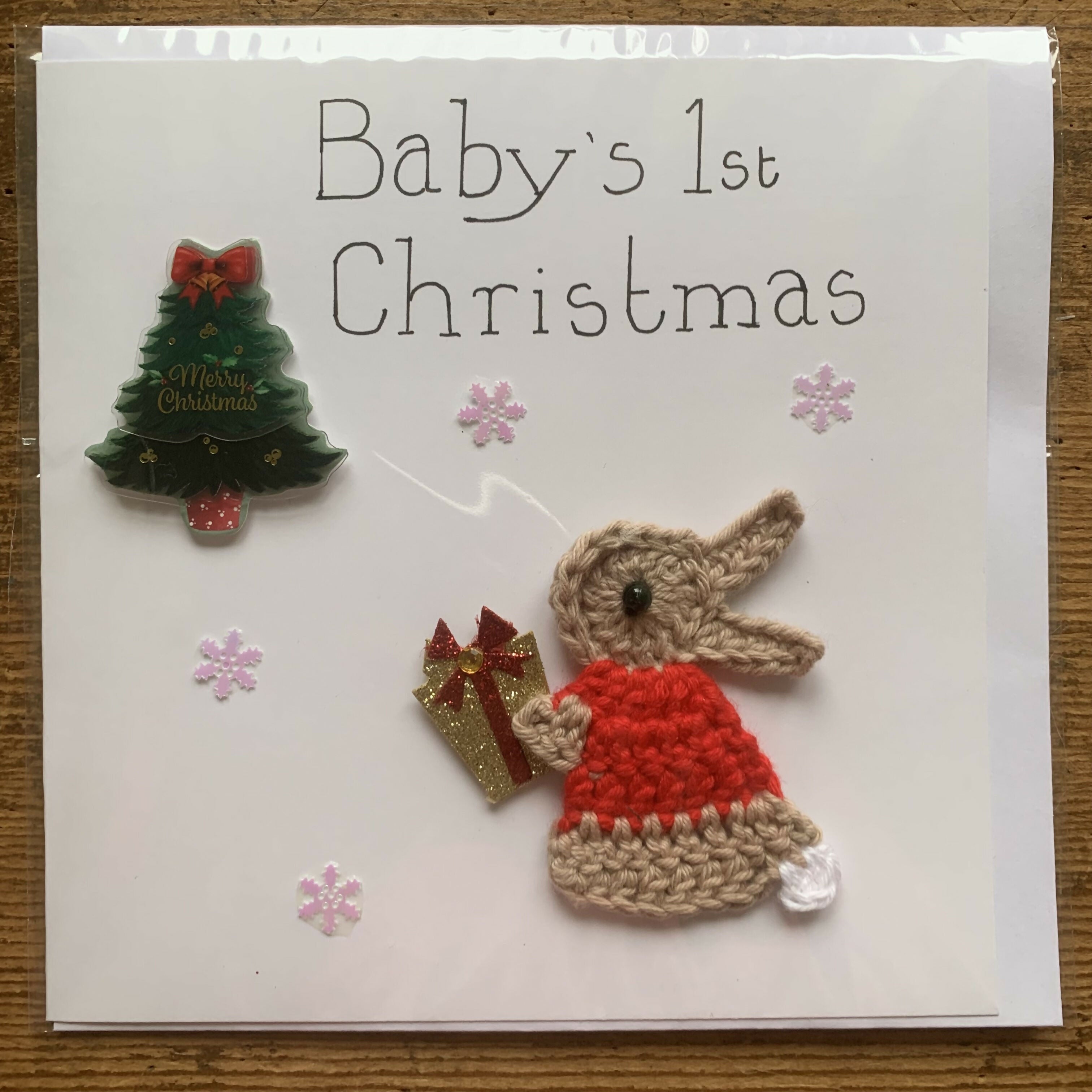 Christmas Card with Crocheted Rabbit with a Present and Christmas Tree.