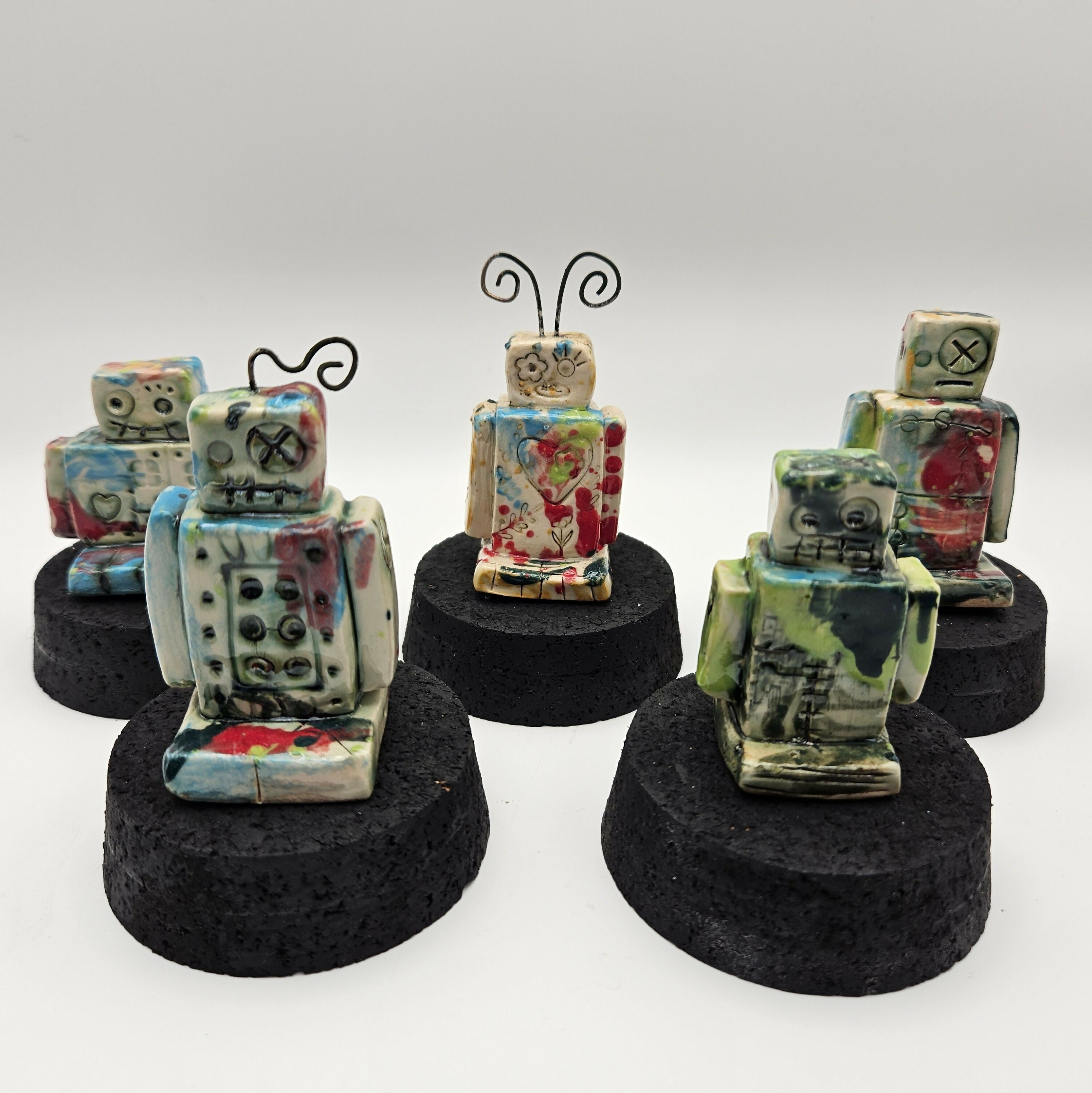 QUIKRY CERAMIC 'MINIBOTS' IN A GLASS CLOCHE