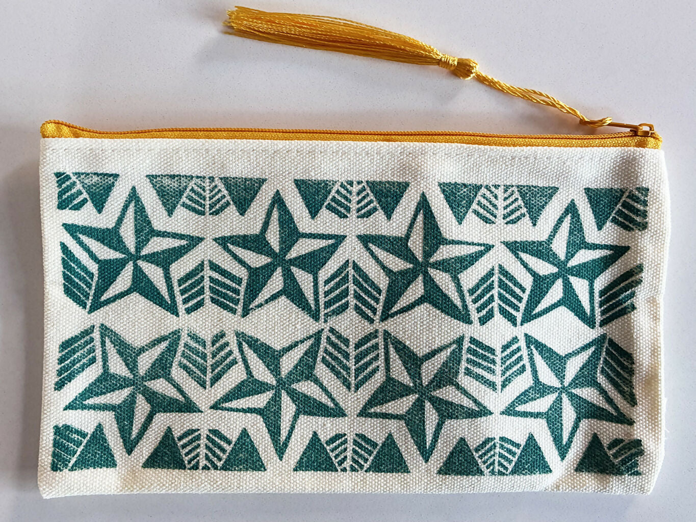 Hand printed Zip Pouch with Turquoise Star Design.