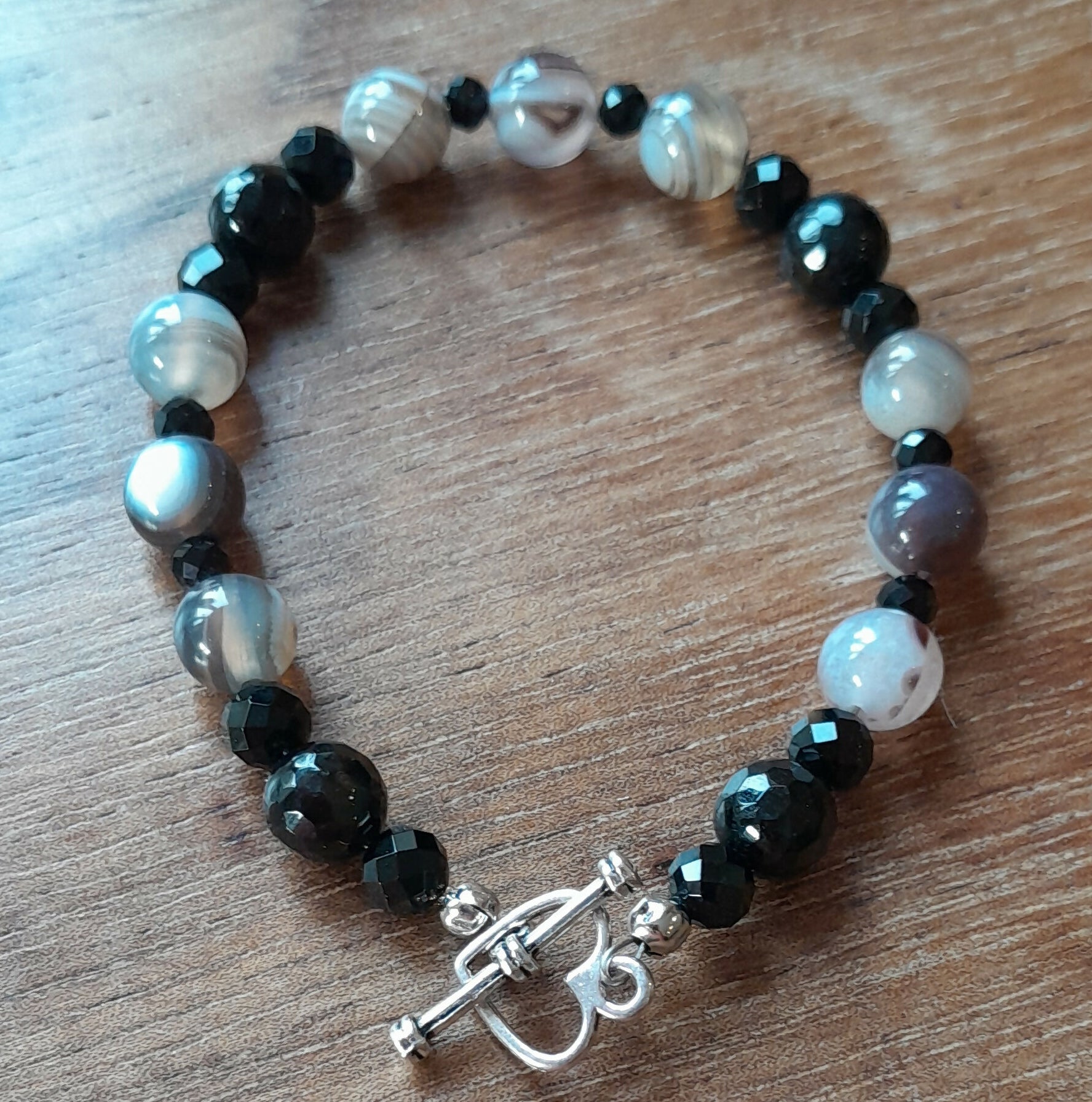 Gemstone Bracelet with Tibetan Silver toggle Catch, Faceted Onyx and Banded Persian Agate.