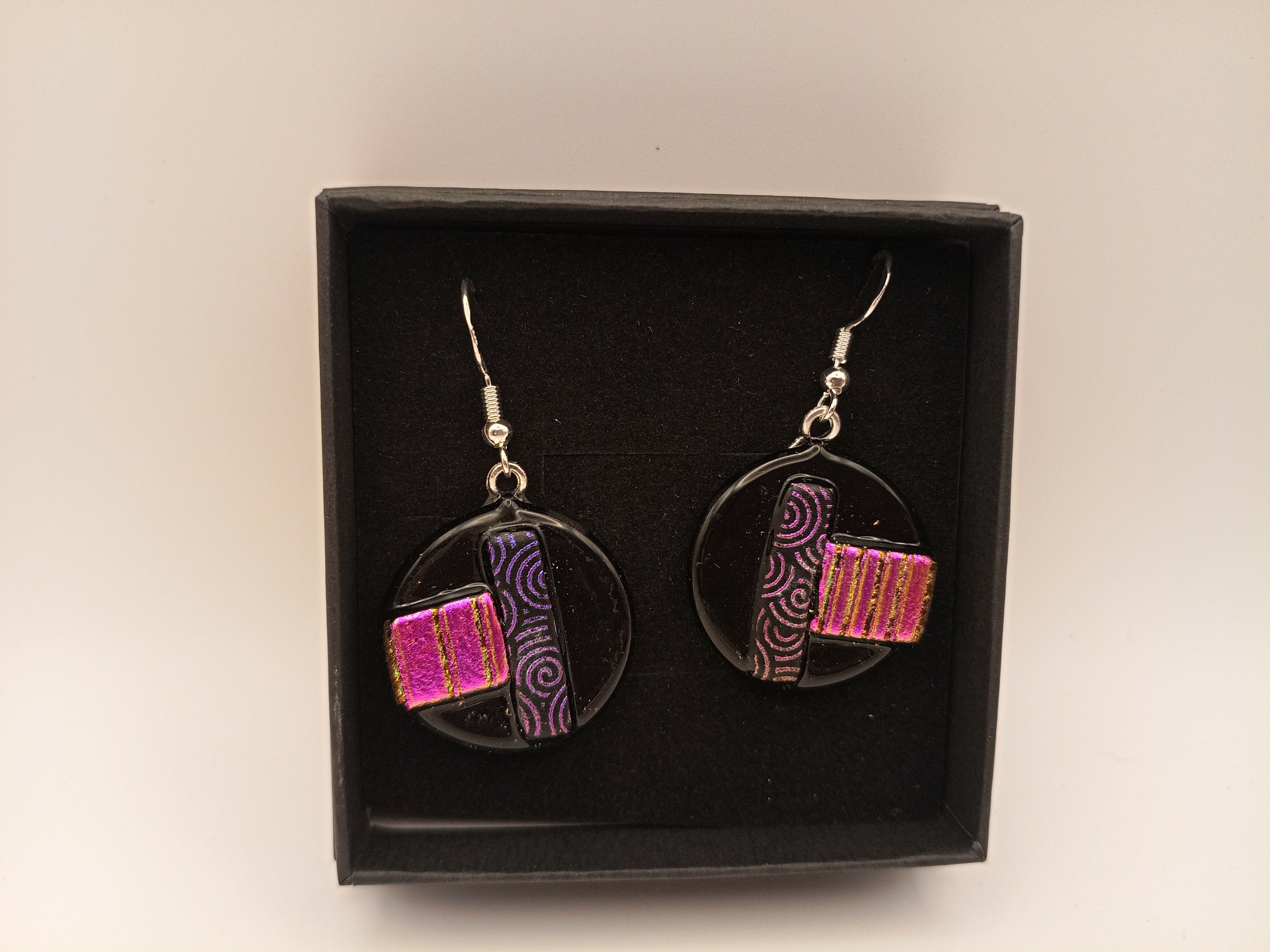 Purple and Pink Dichroic Circle Earrings on Black