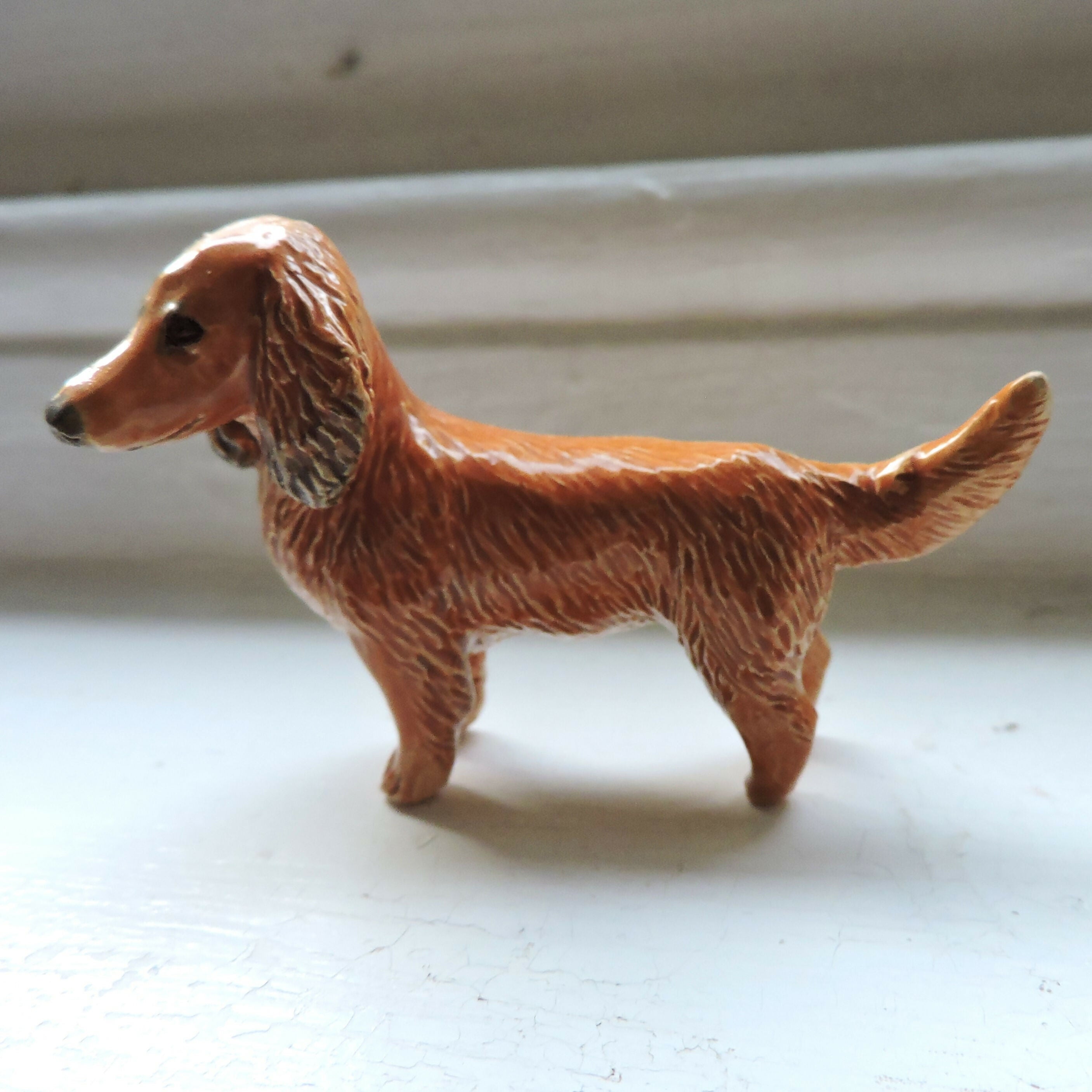 Ceramic Red Longhaired dachshund dog sculpture