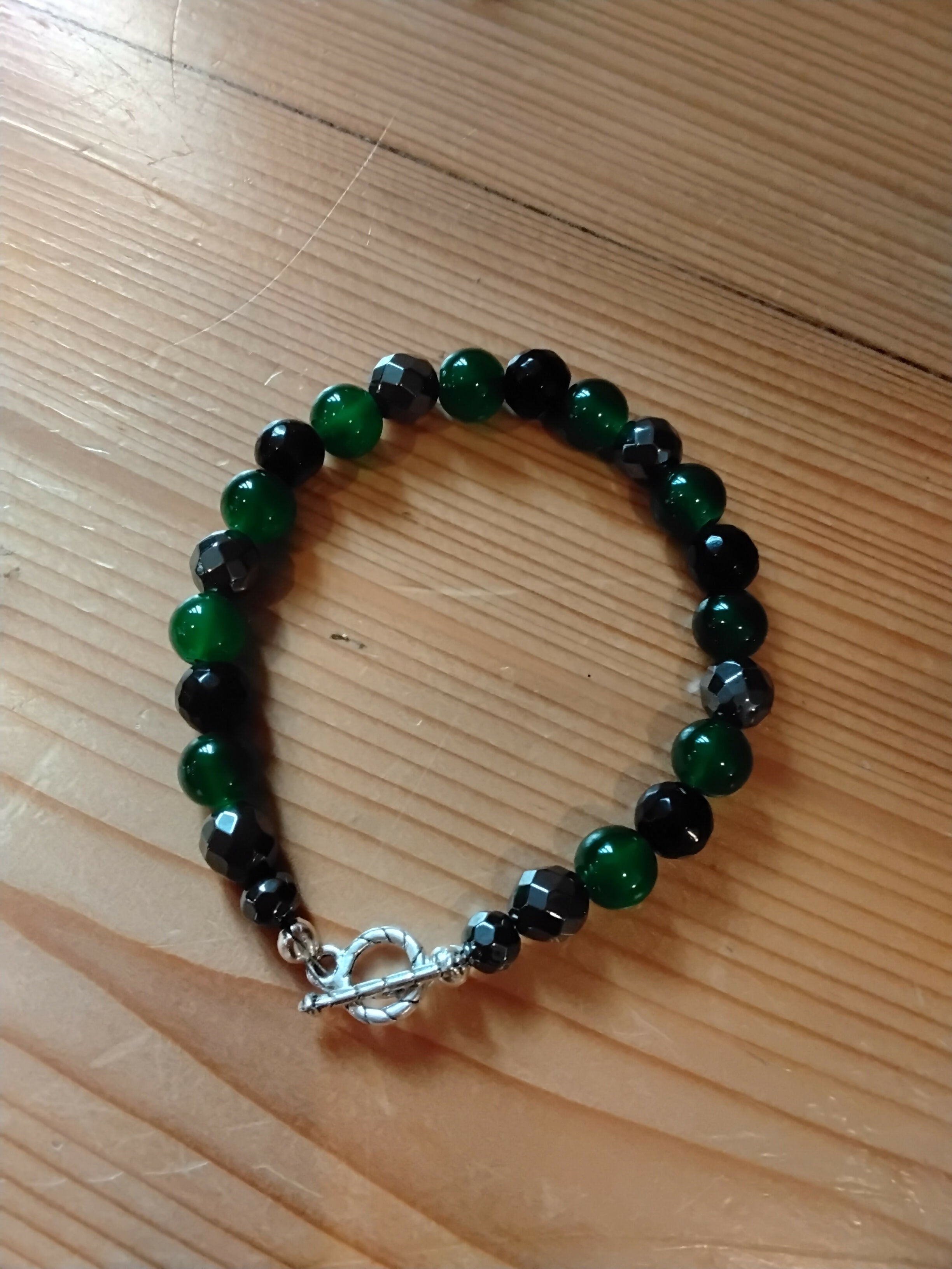 Tibetan Silver Toggle Catch Bracelet with Faceted Silver Hematite, Green Chalcedony and Faceted Onyx.