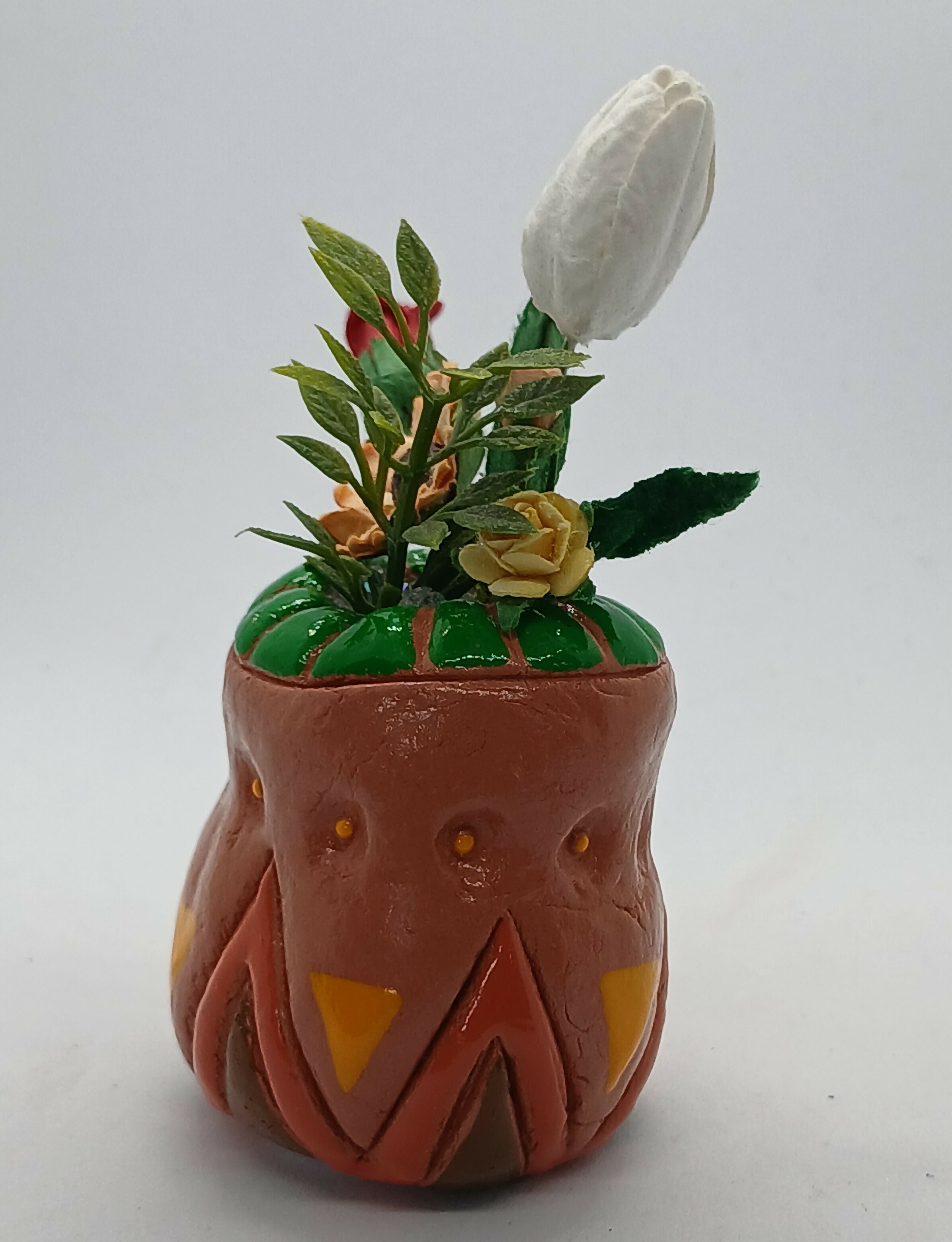 Small Clay Vase and Faux Flowers