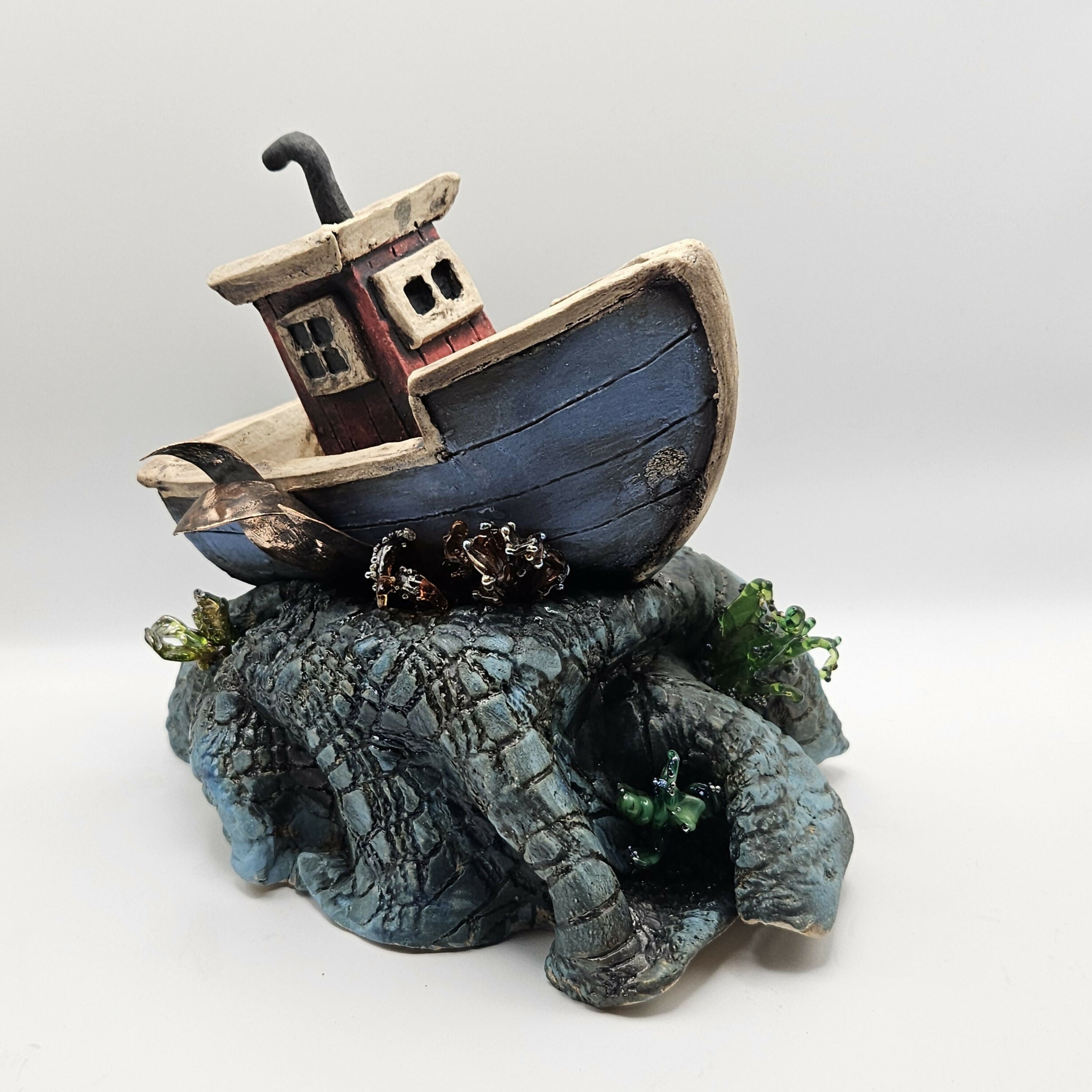 'SEAS THE DAY' CERAMIC BOAT ON WAVES WITH GLASS ELEMENTS