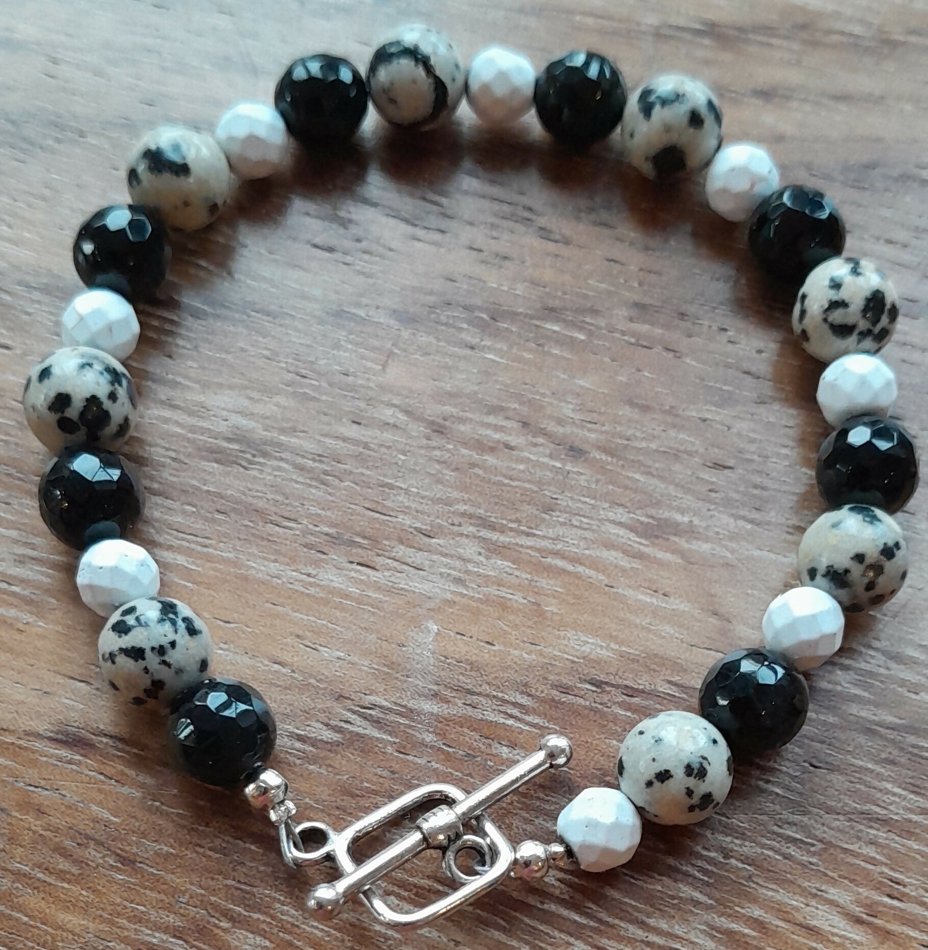 Gemstone Bracelet with Tibetan Silver toggle Catch, Faceted Onyx, Dalmatian Jasper and Faceted Howlite.