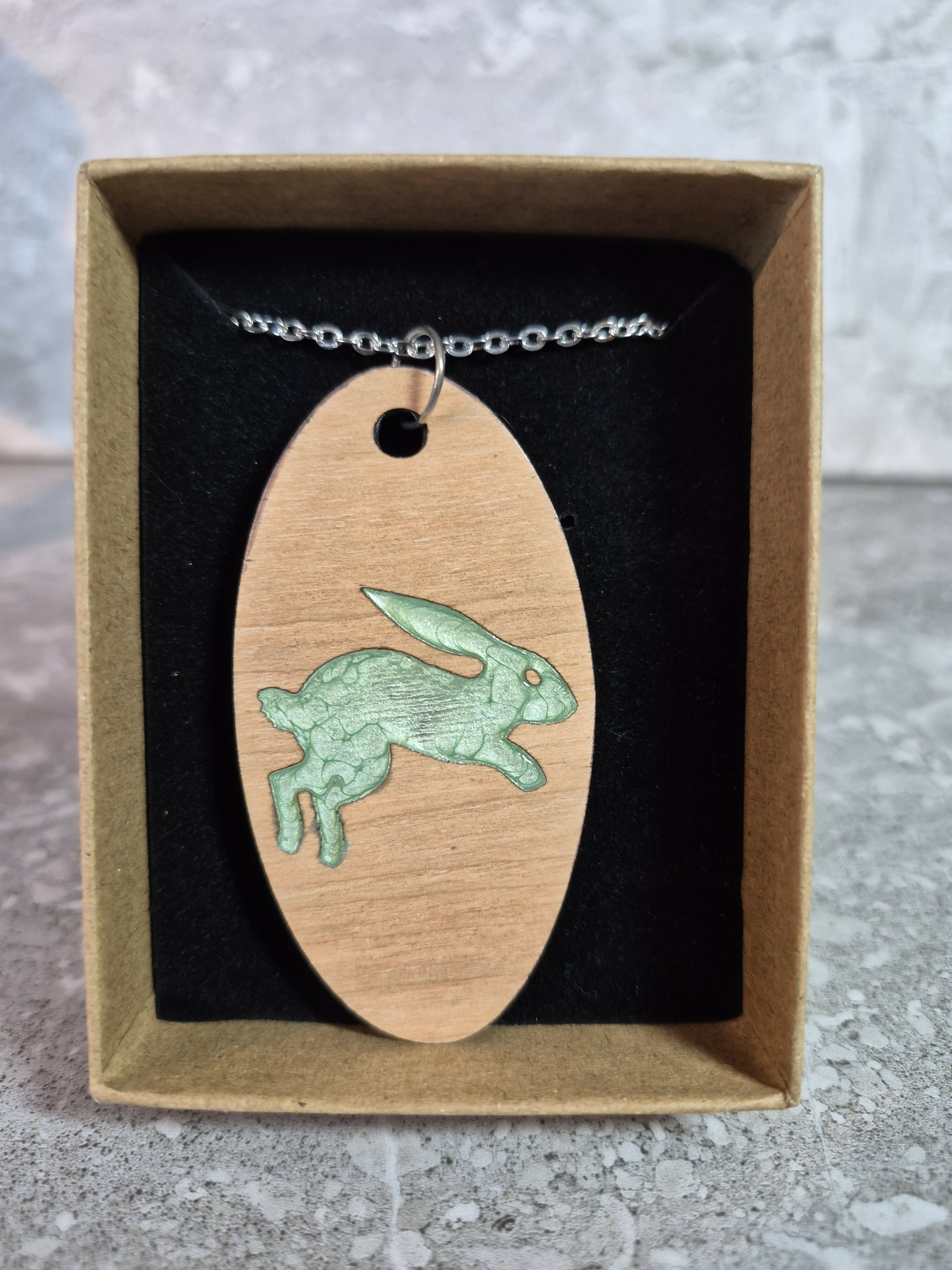 Unique Handcrafted Oval Cherry Wood Veneered Pendant With Engraved Leaping Hare