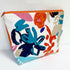 White wash bag with orange and blue print