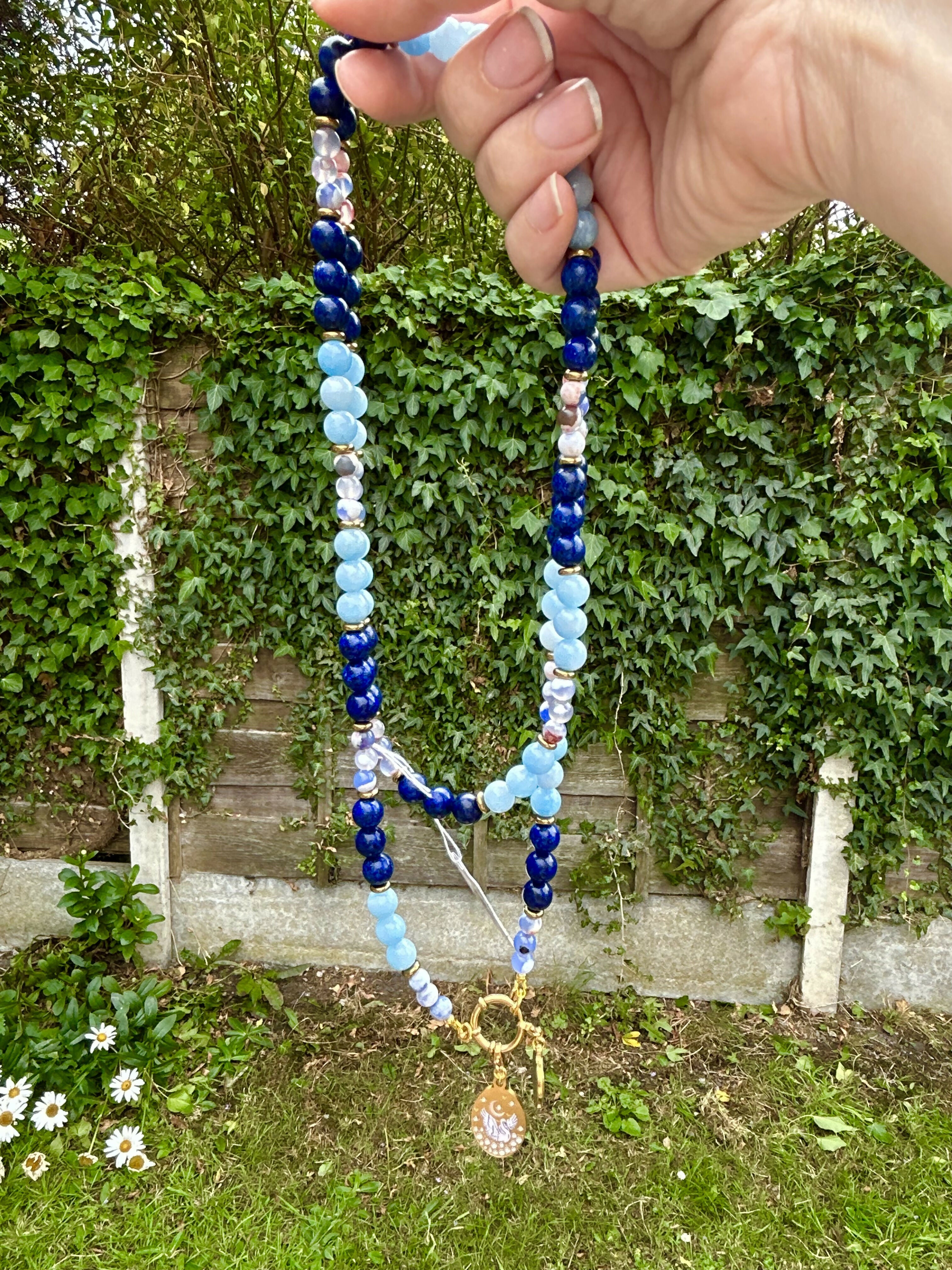 Extra long natural stone and hematite charm necklace