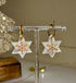 STAR HOOP WITH GOLD ENGRAVED SNOWFLAKE DESIGN