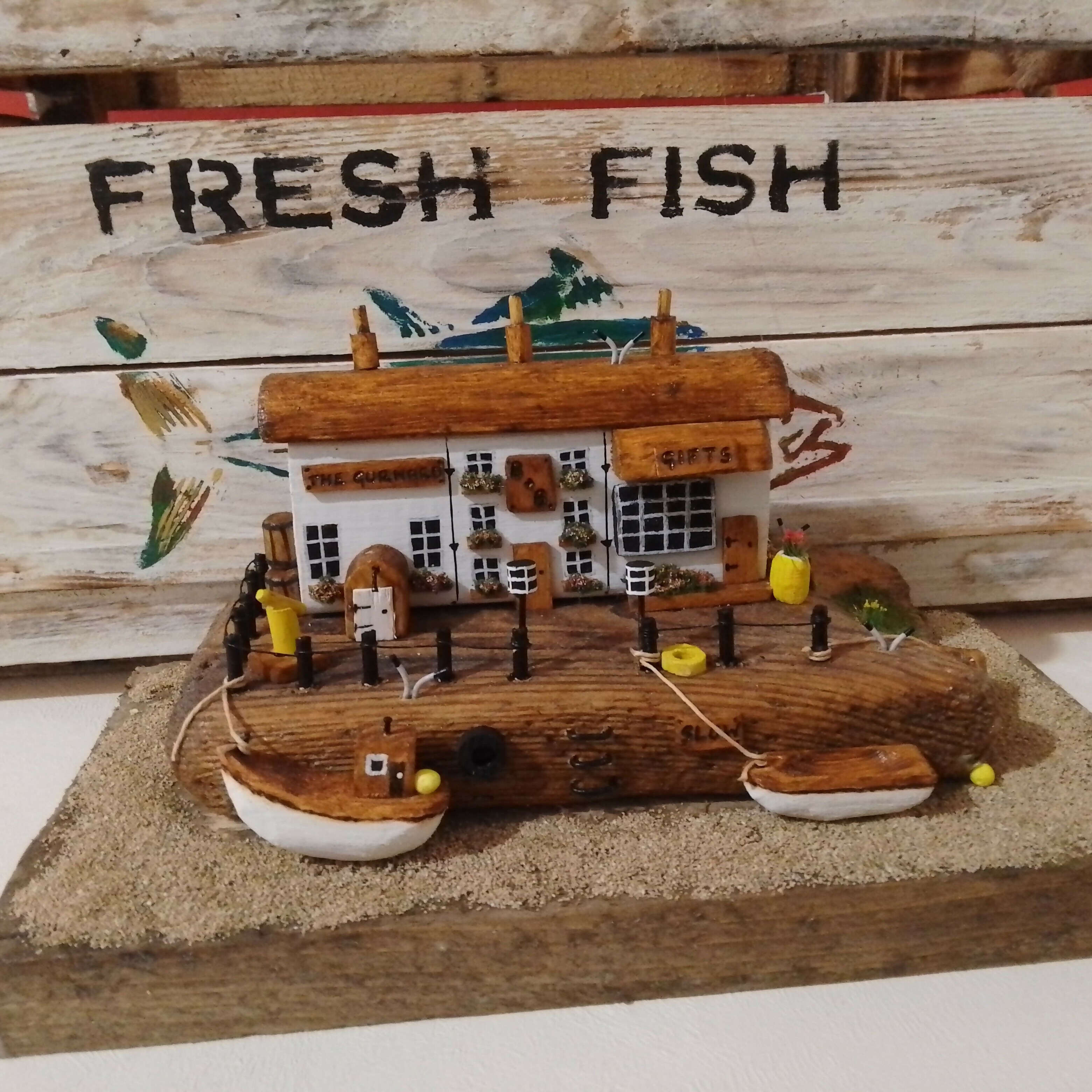 Rustic Harbour Scene: Boats, Pub, B and B, and Chip Shop