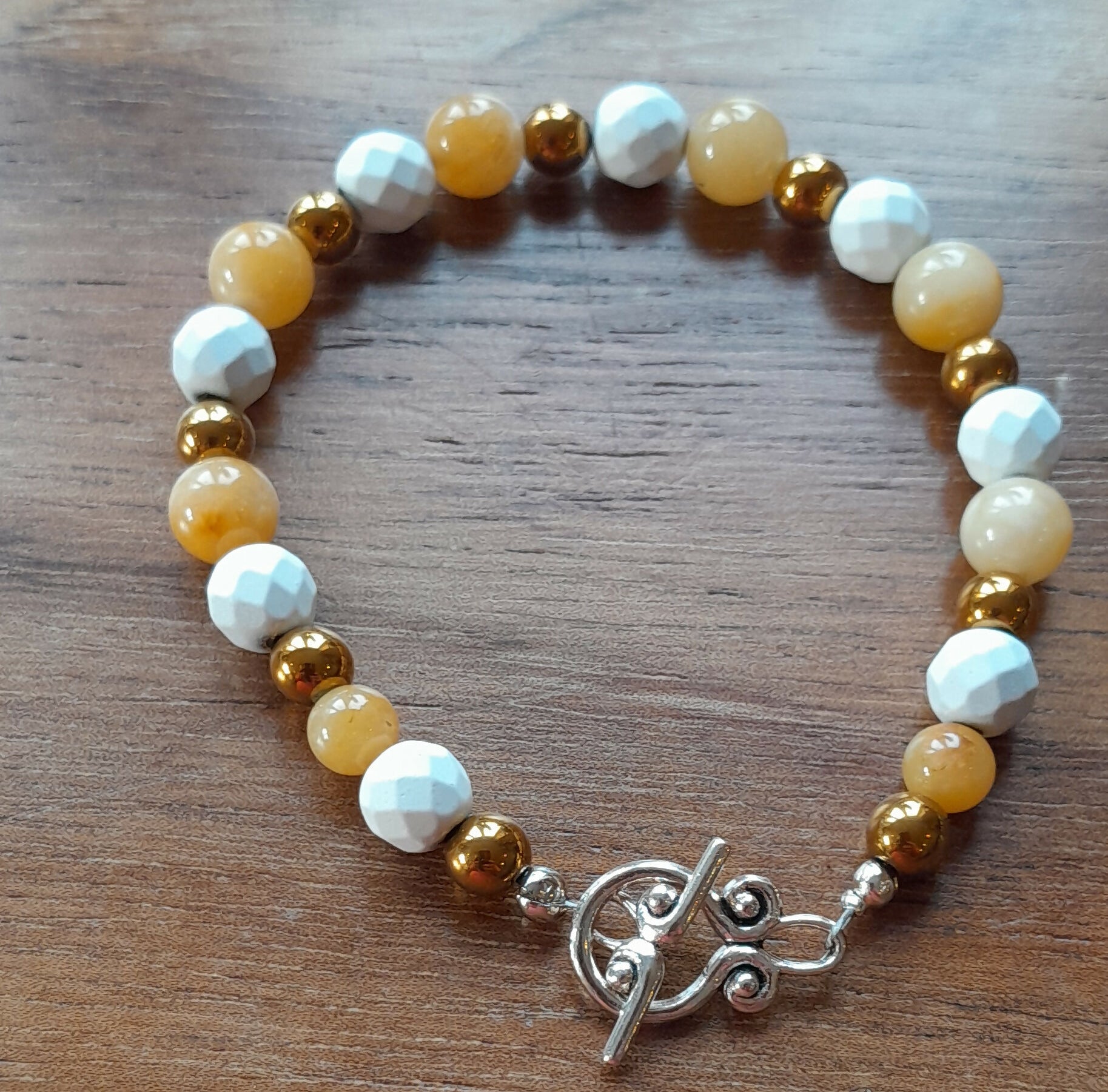 Gemstone Bracelet with Tibetan Silver Toggle Catch, Bronze Hematite, Faceted Howlite and Yellow Jade.