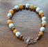Gemstone Bracelet with Tibetan Silver Toggle Catch, Bronze Hematite, Faceted Howlite and Yellow Jade.