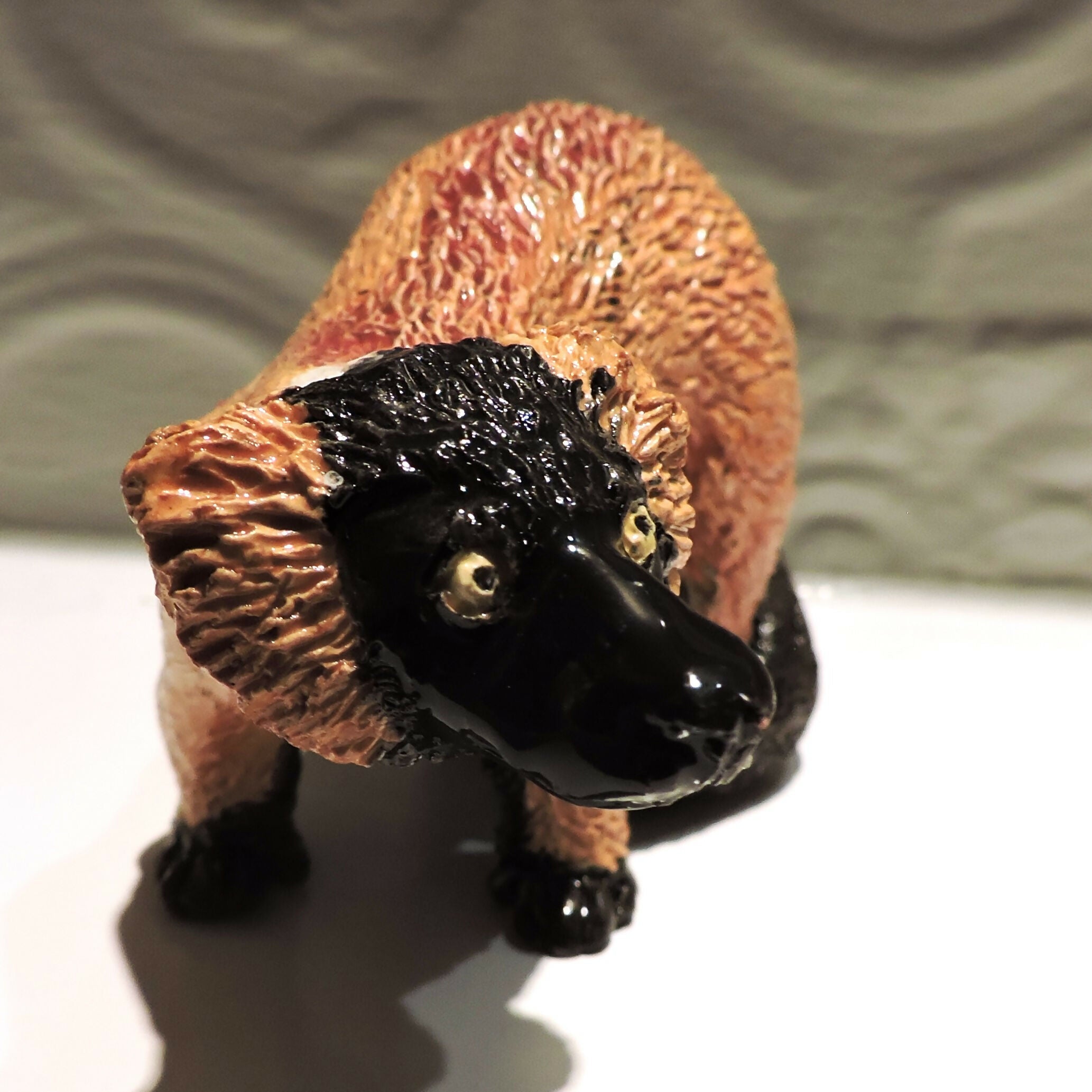 Ceramic standing Red ruffed lemur sculpture