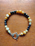 Tibetan Silver Toggle Catch Bracelet with Aged Yellow Jade & Navy Goldstone.