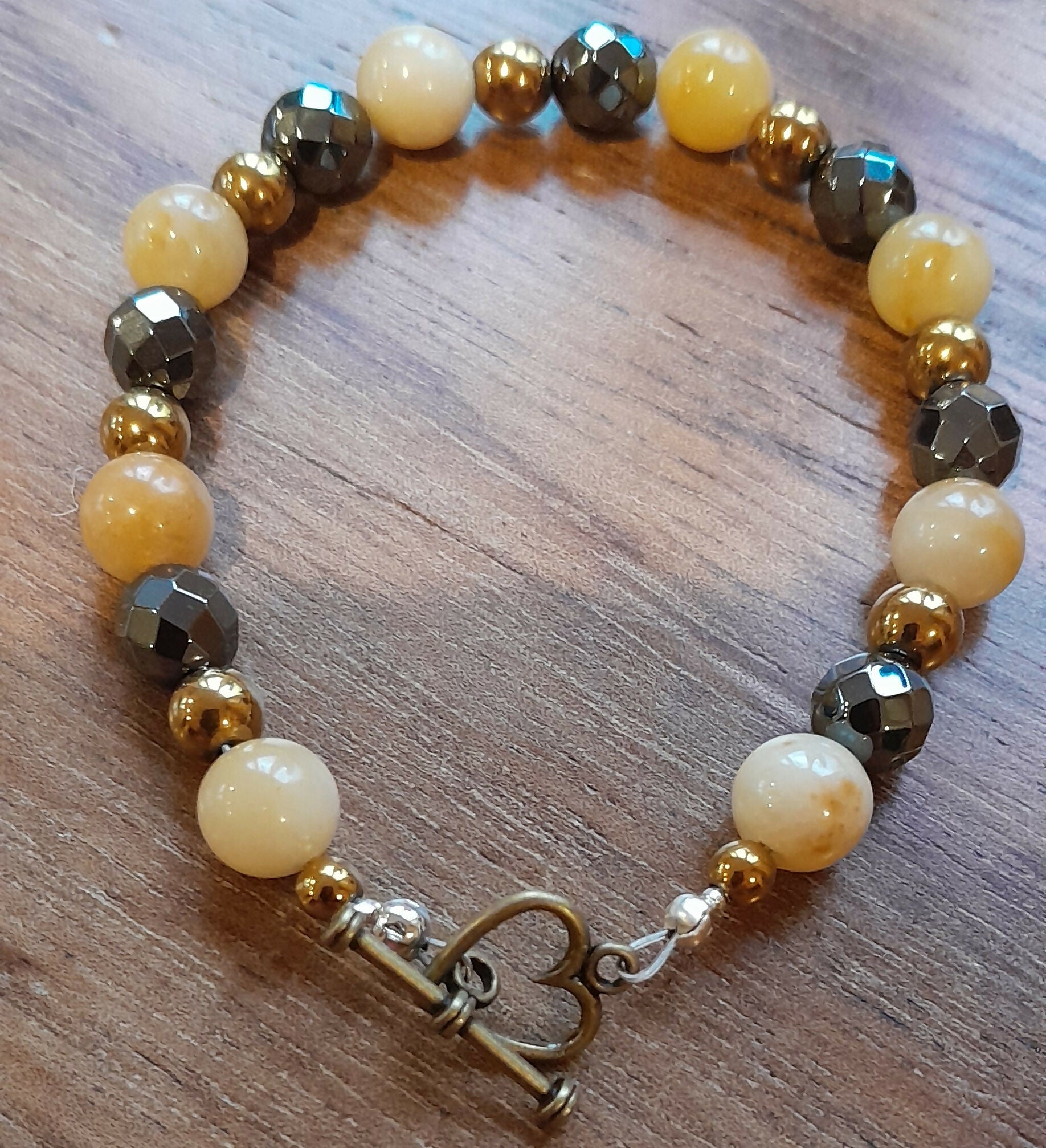 Gemstone Bracelet with Bronze Toggle Catch, Bronze Hematite, Yellow Jade, and Faceted Grey Hematite.