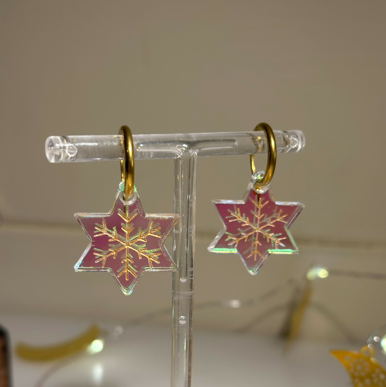 STAR HOOP WITH GOLD ENGRAVED SNOWFLAKE DESIGN