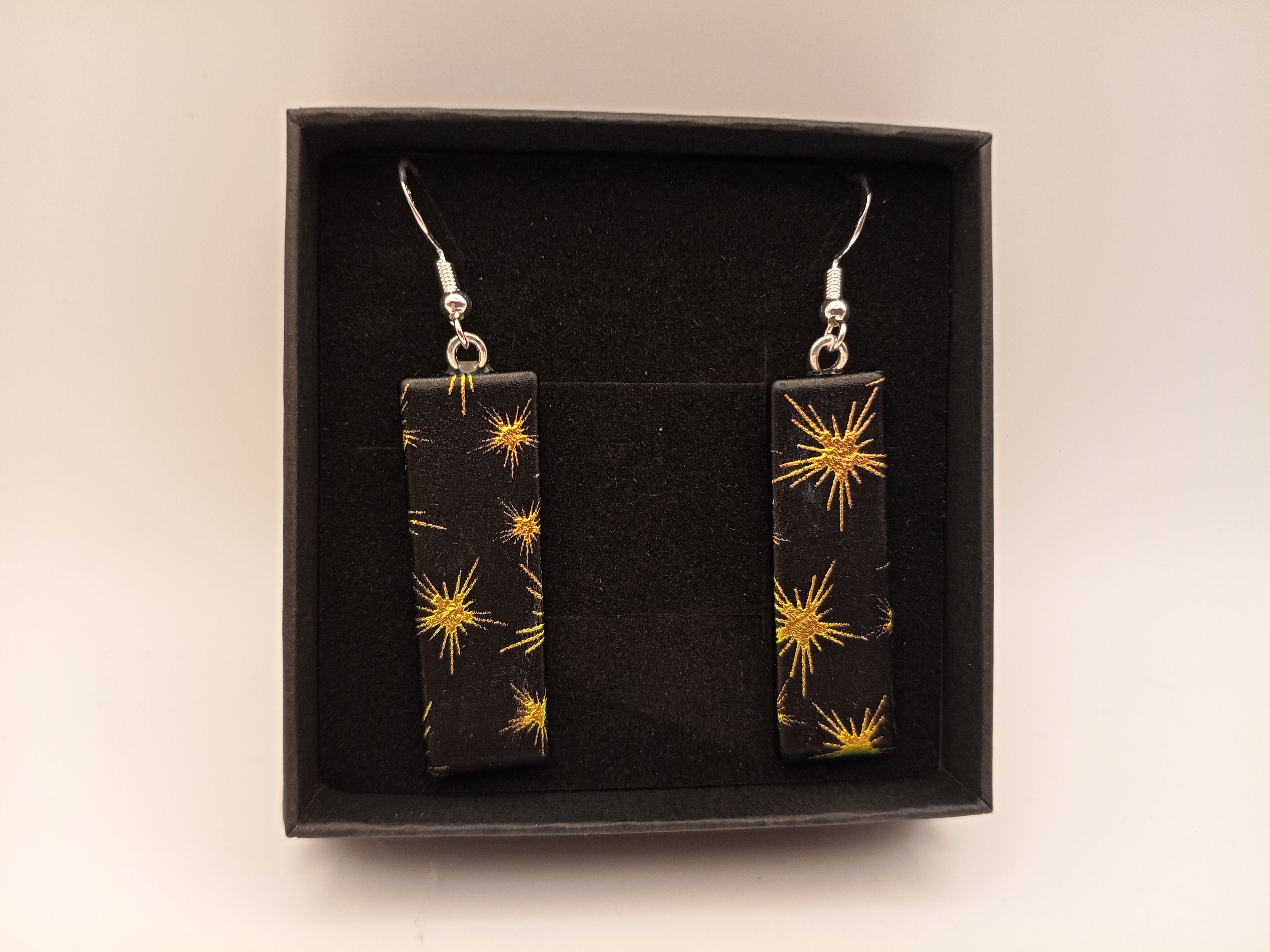 Yellow and Green Stars on Black Earrings