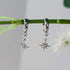 Tiny Silver Cubic Zirconia Star Earrings on a Silver Plated Half Loop Huggie Stud