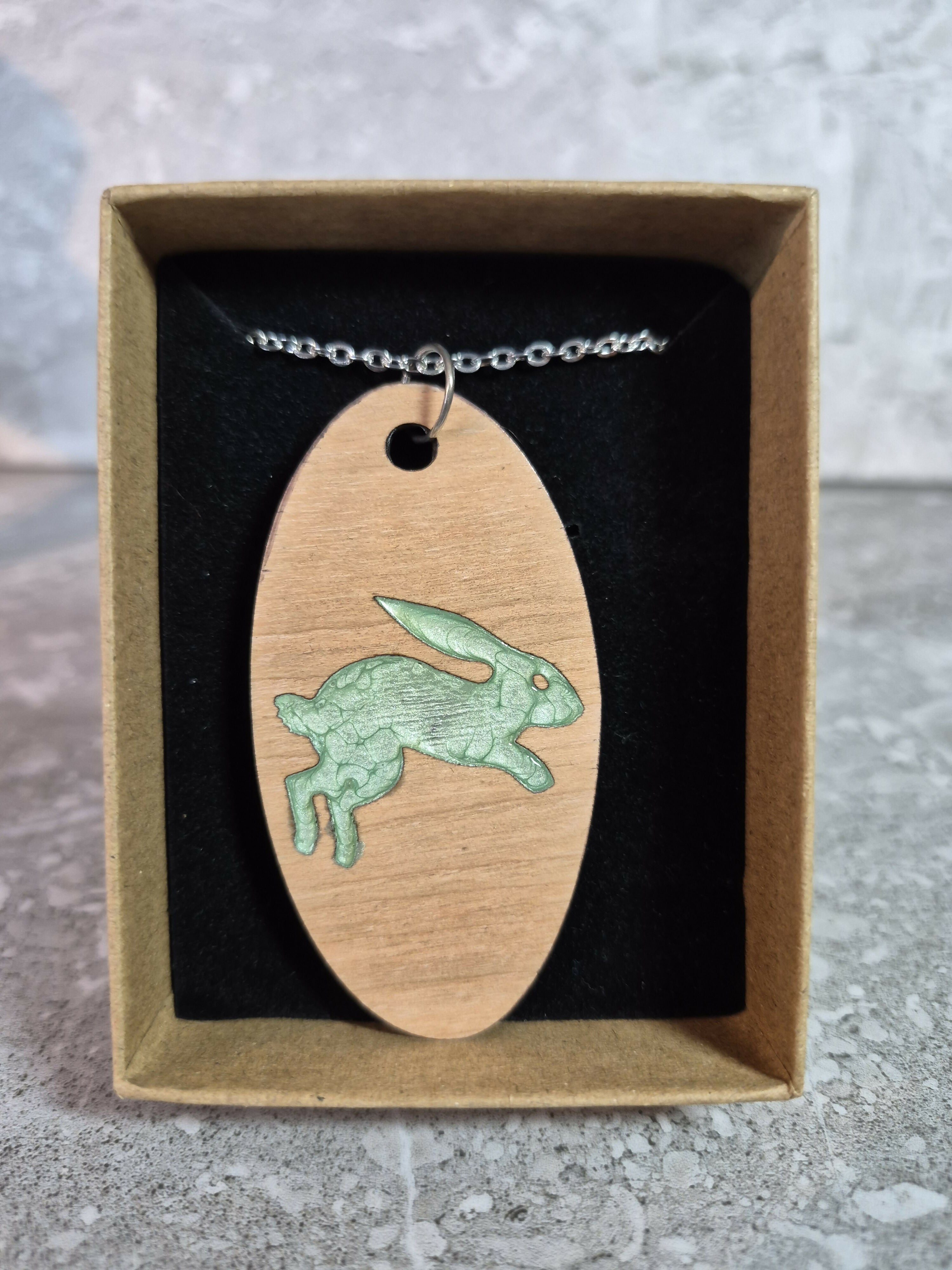 Unique Handcrafted Oval Cherry Wood Veneered Pendant With Engraved Leaping Hare