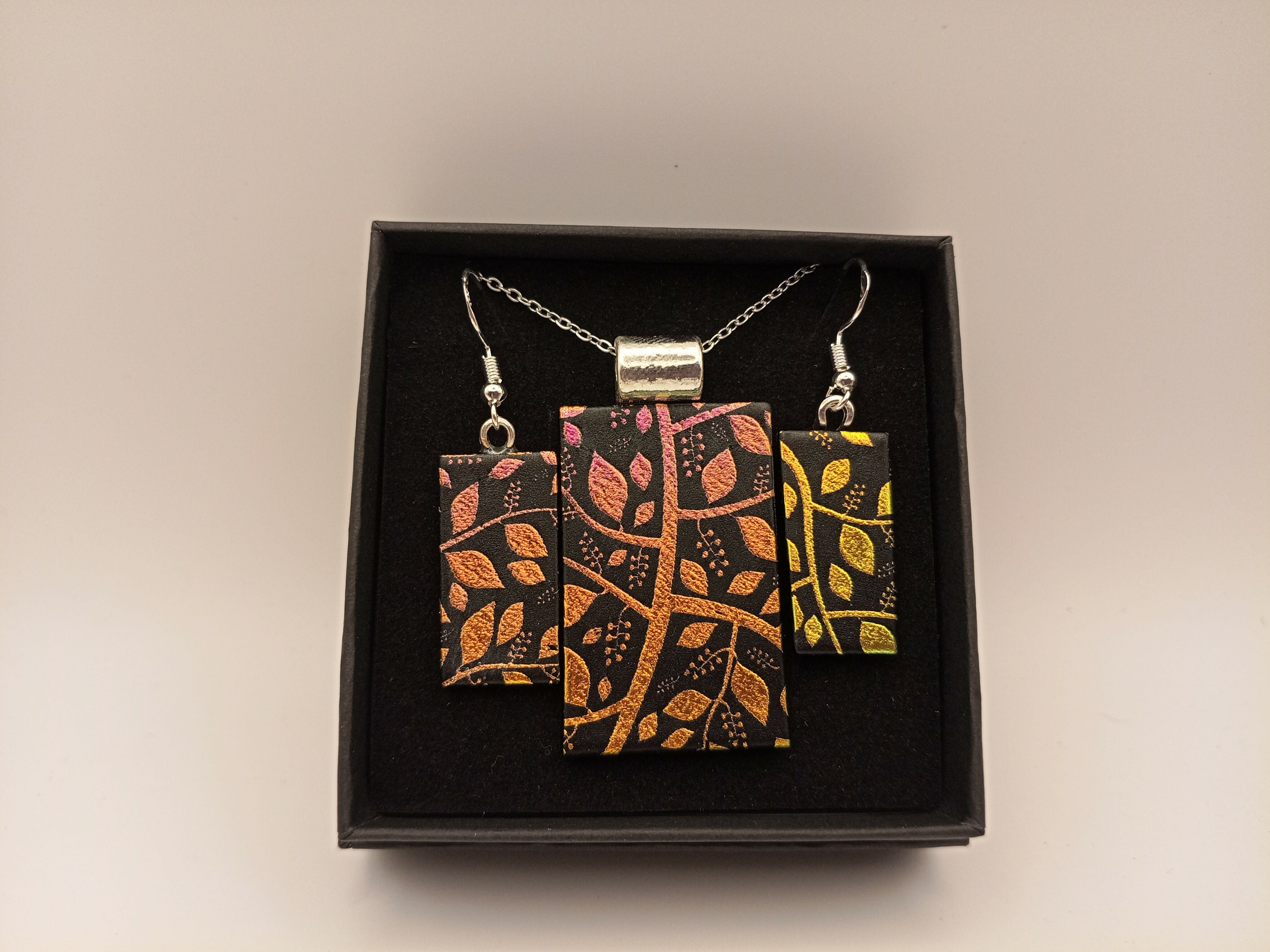 Green, Orange and Yellow Leaf Dichroic Pattern on Black Pendant set