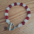 Tibetan Silver Toggle Bracelet with Tibetan Silver Spacers, Rose Quartz and Red Chalcedony.