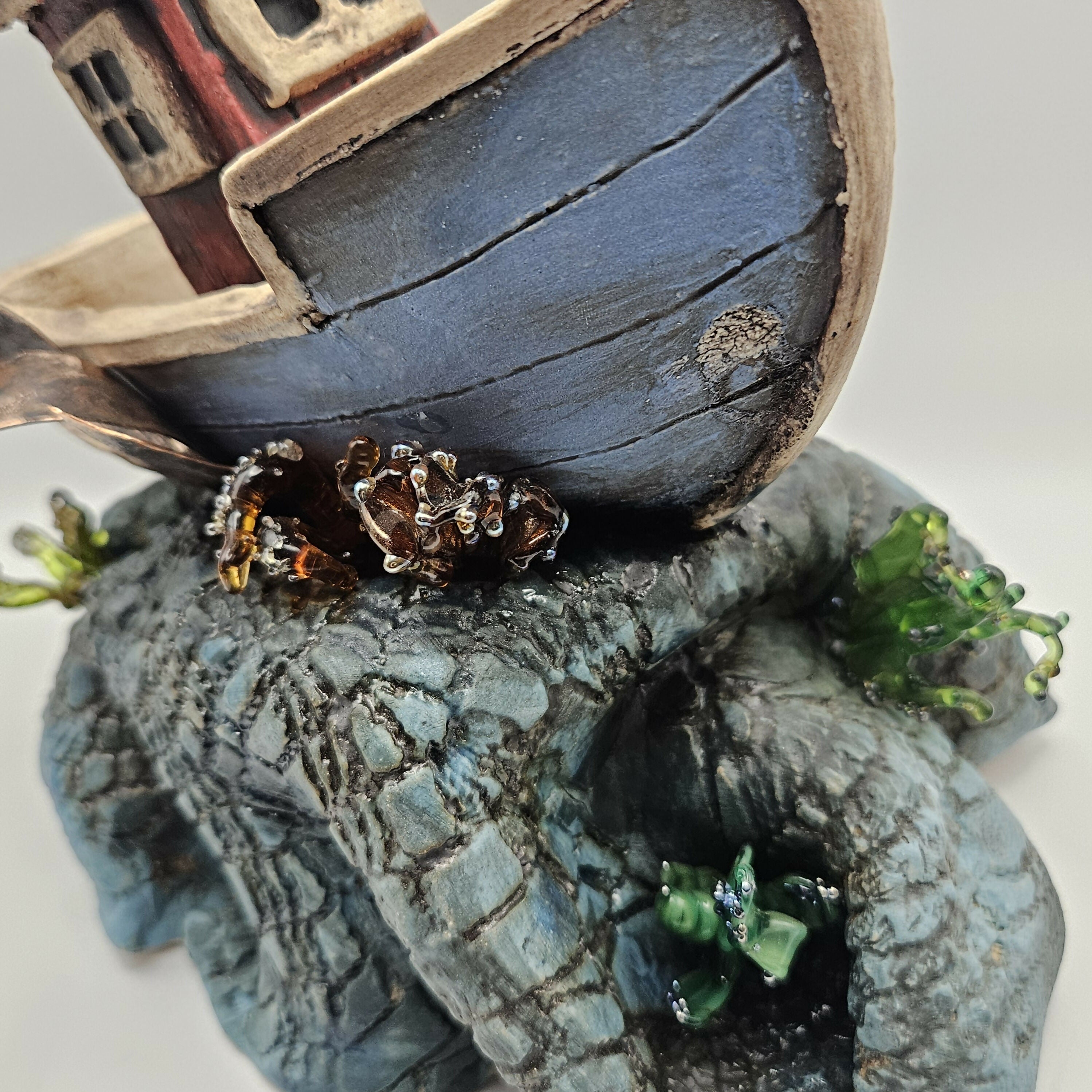 'SEAS THE DAY' CERAMIC BOAT ON WAVES WITH GLASS ELEMENTS