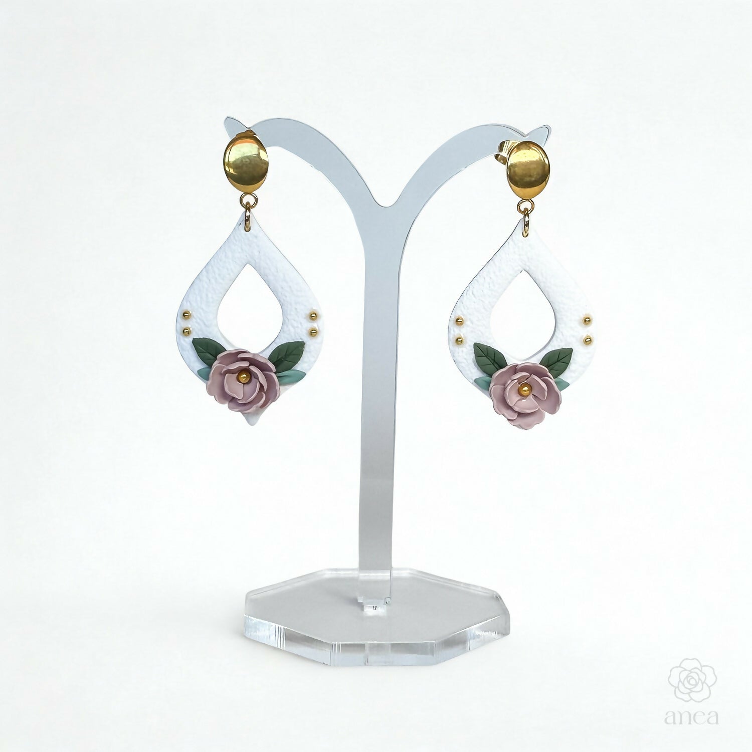 Floral Drop Earrings with Embossed Texture and Gold Detail in Pastel Pink