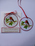 Hand painted glass circle with a robin.
