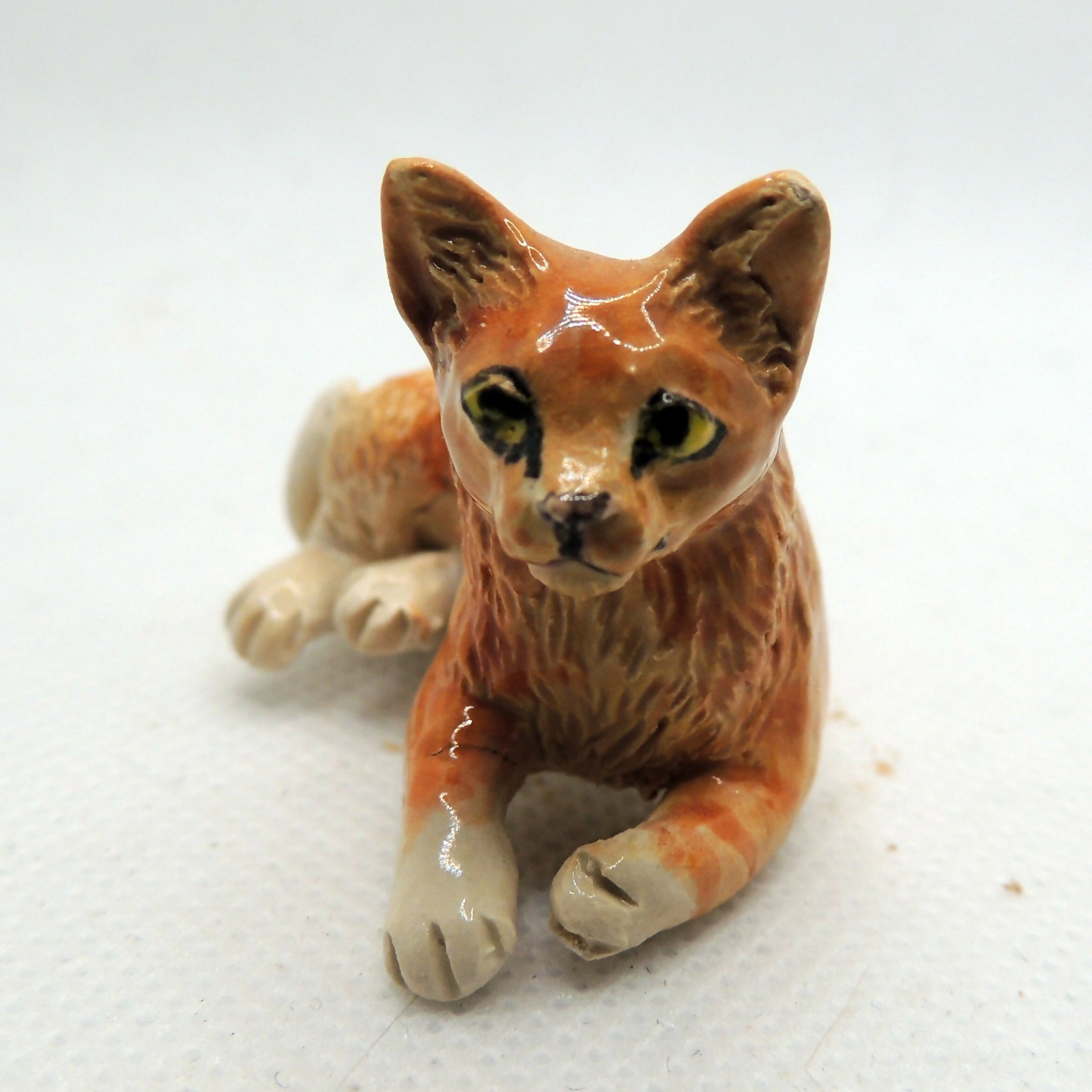 Ceramic ginger cat sculpture