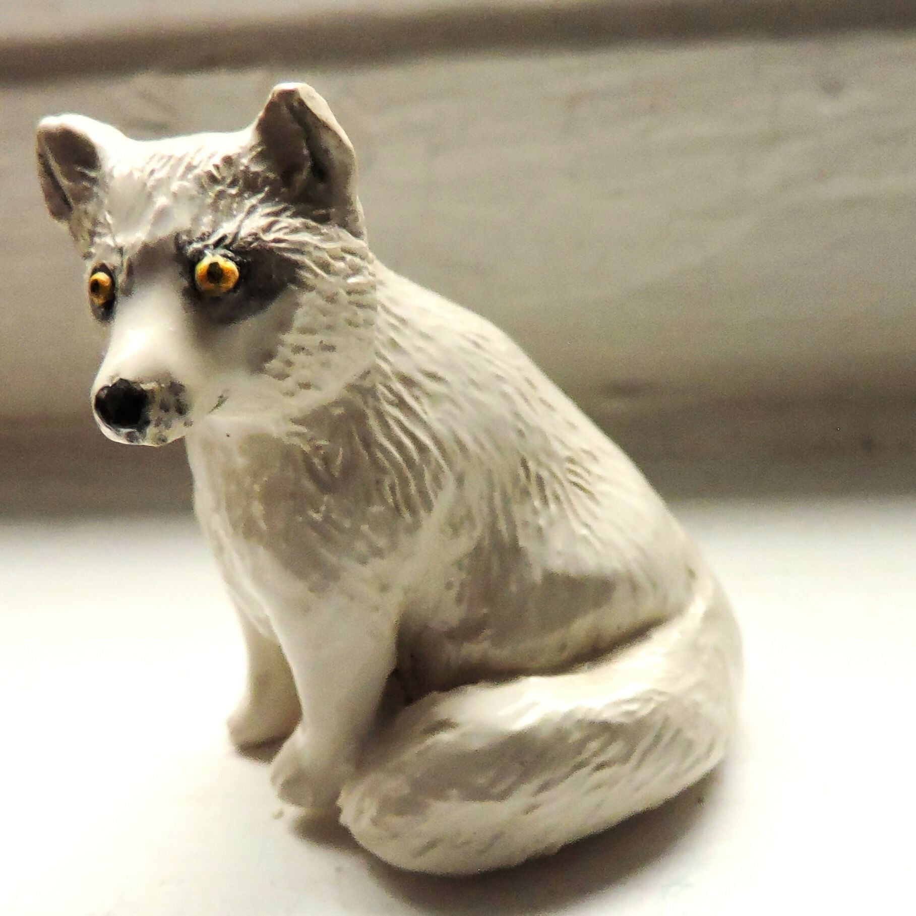 Ceramic Arctic fox sculpture