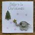 Christmas Card with Crocheted Elephant Putting Star on the Christmas tree.