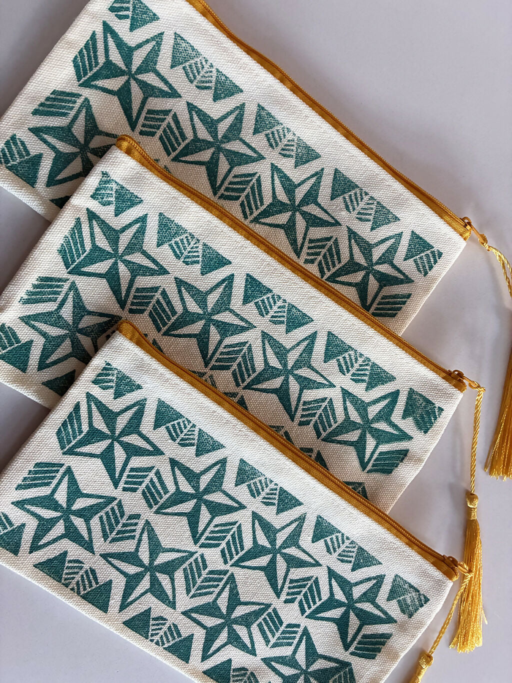 Hand printed Zip Pouch with Turquoise Star Design.