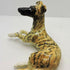 Ceramic lying Whippet dog sculpture, Black mask Brindle