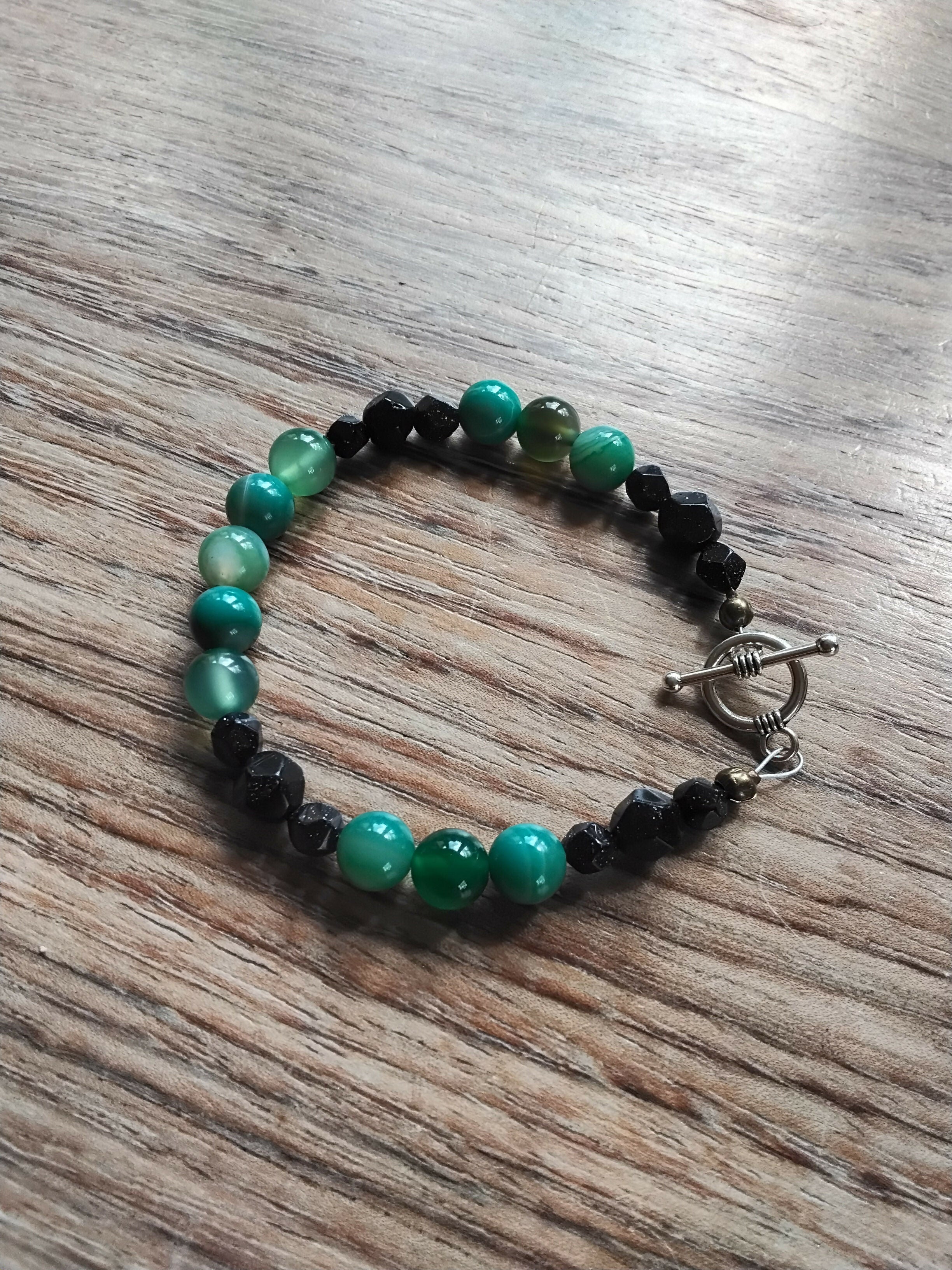 Tibetan Silver toggle Catch Bracelet with Faceted Navy Goldstone and Banded Green Agates.t