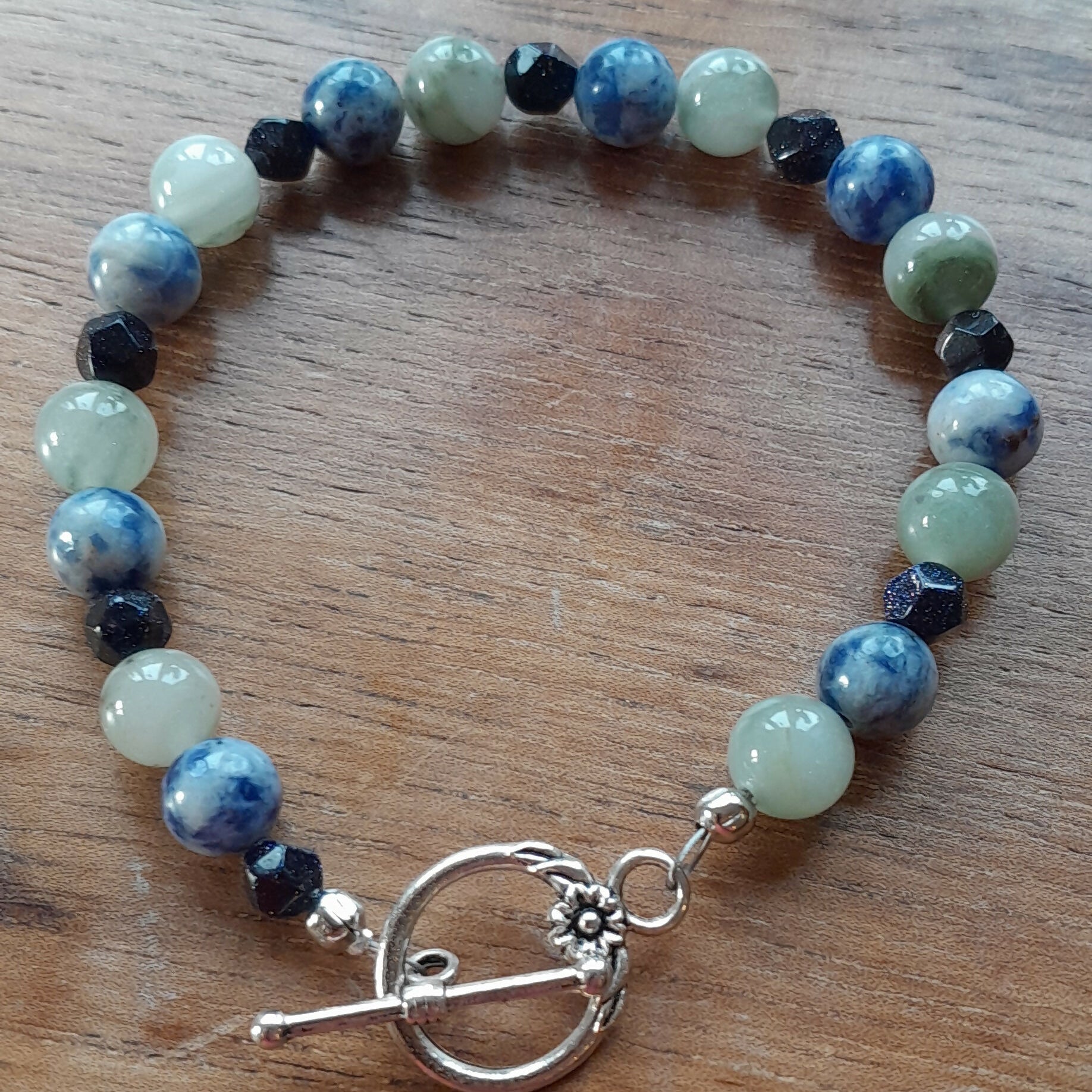 Gemstone Bracelet with a Tibetan Silver Toggle Catch, Banded Green Agate, Blue Spotted Jasper and Faceted Navy Goldstone.