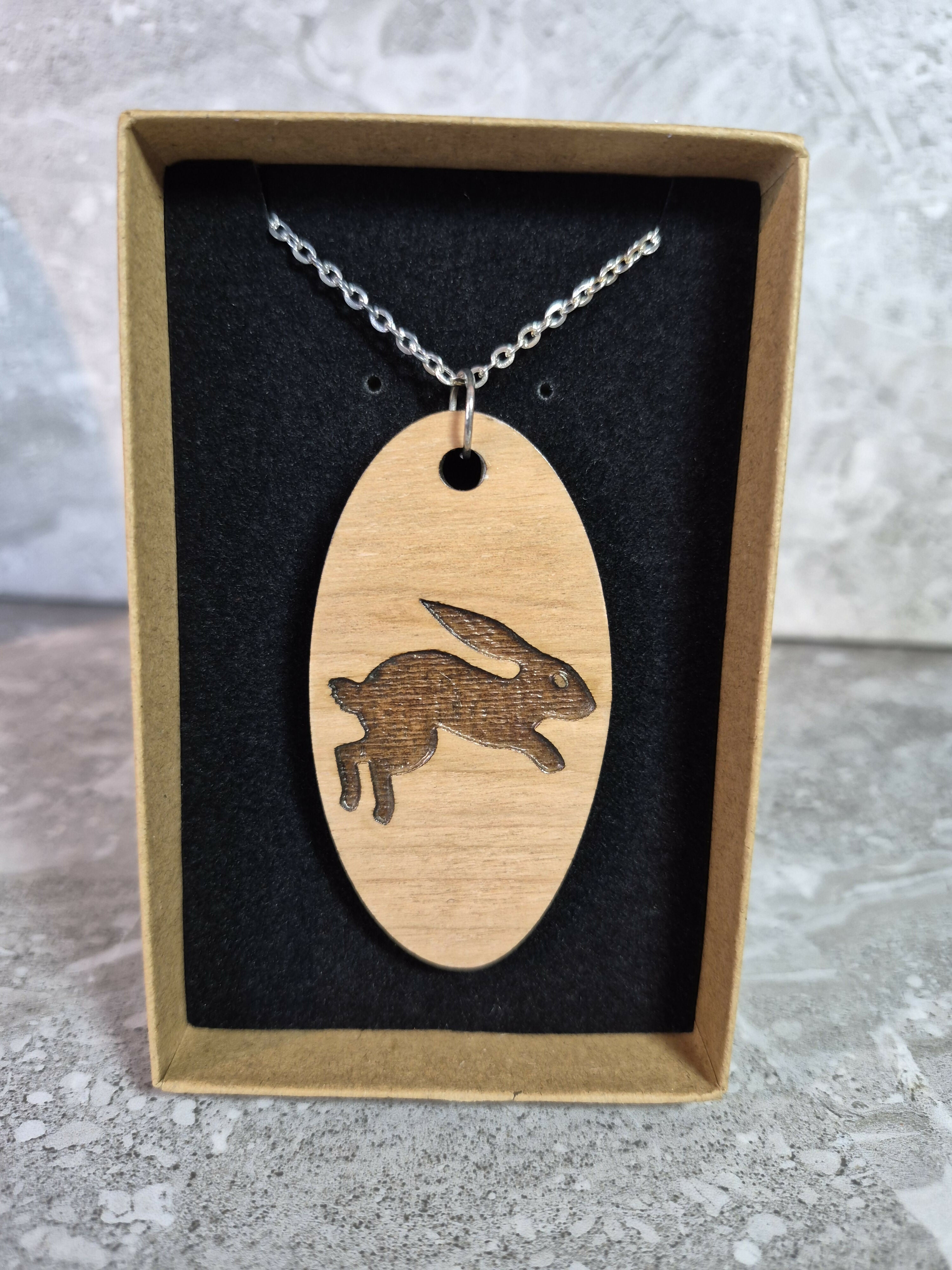 Unique Handcrafted, Oval, Cherry Veneered, Pendant With An Engraved Leaping Hare