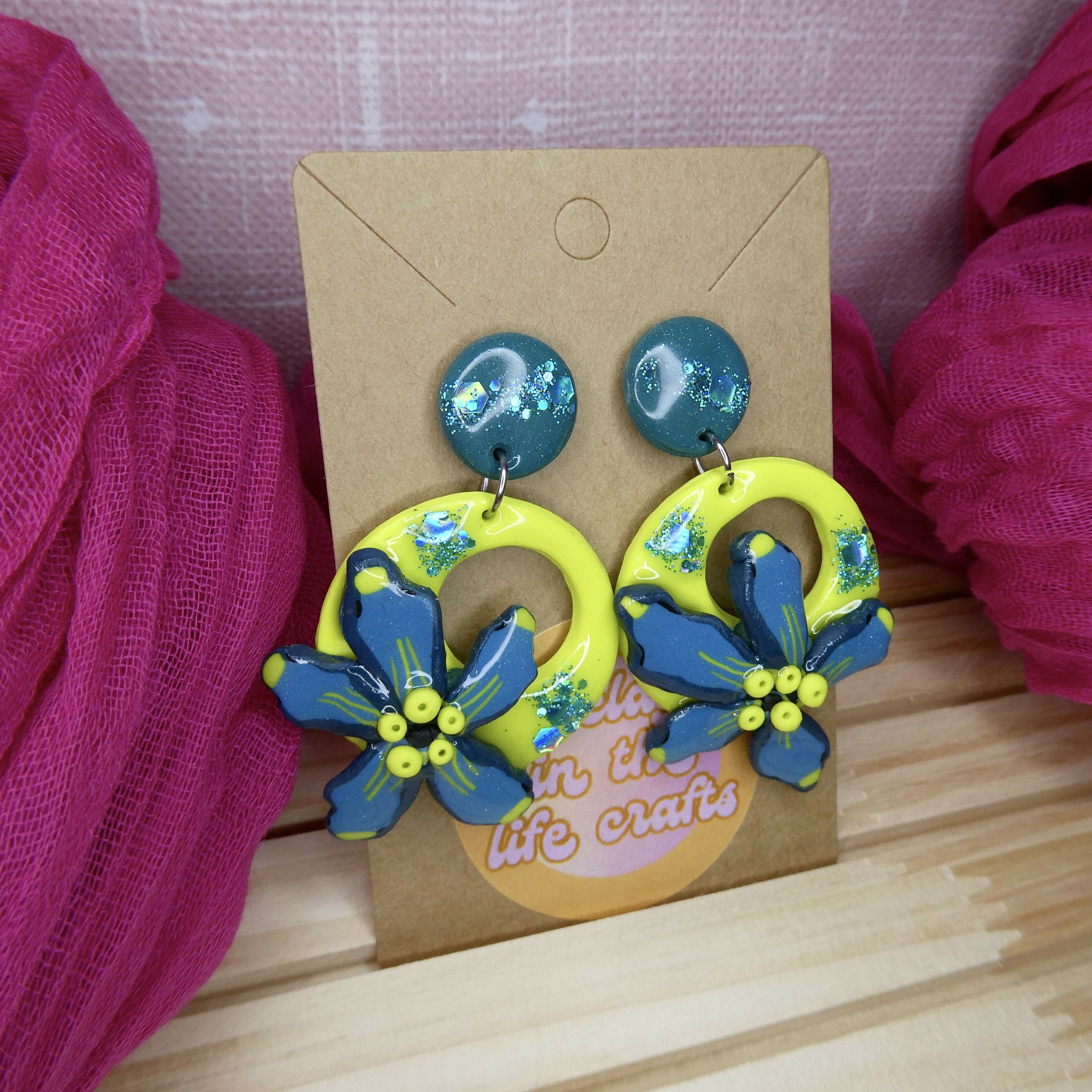 Neon Green And Turquoise Flower Earrings With Blue Glitter Detail
