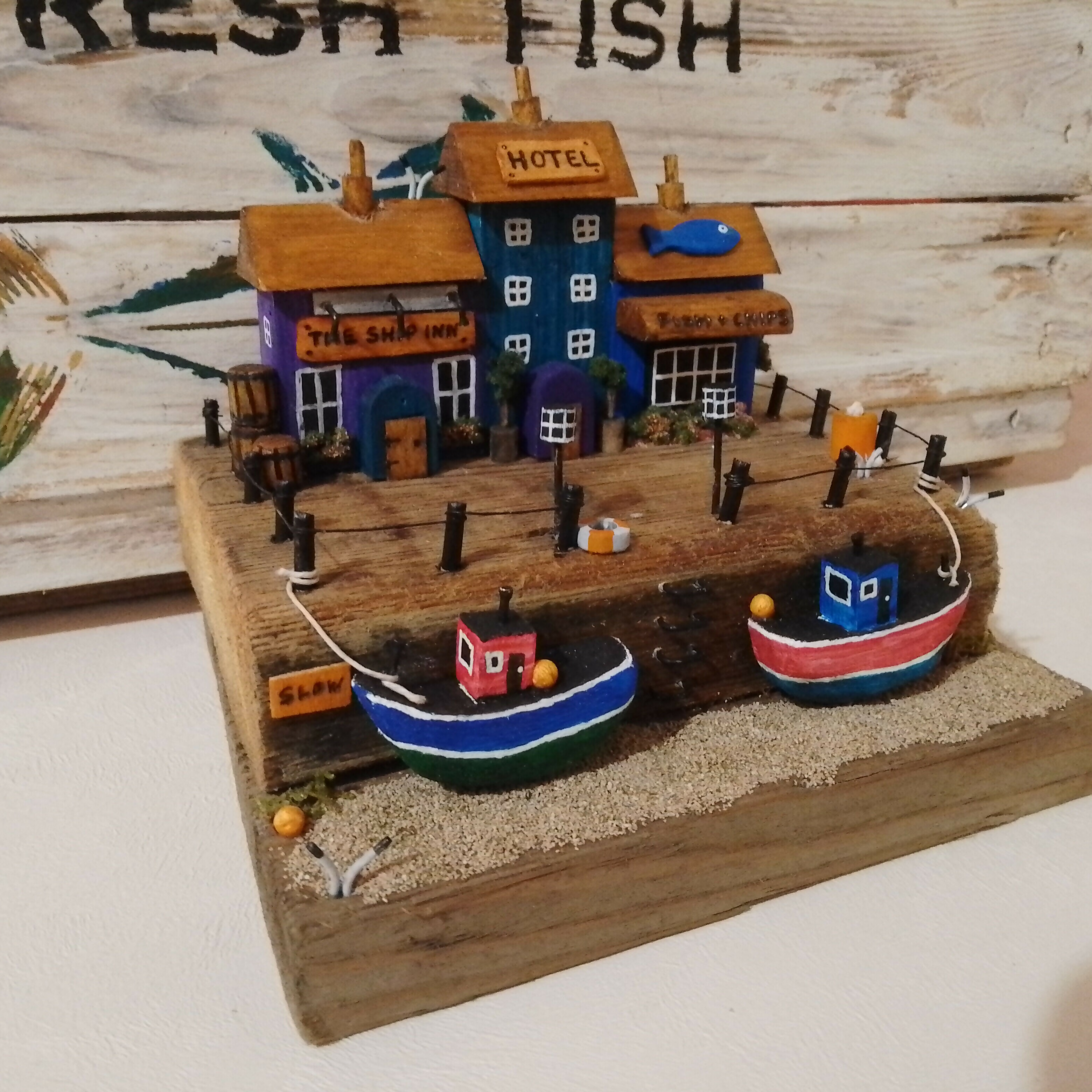 Harbour Scene: Boats, Pub, Gift shop and Hotel