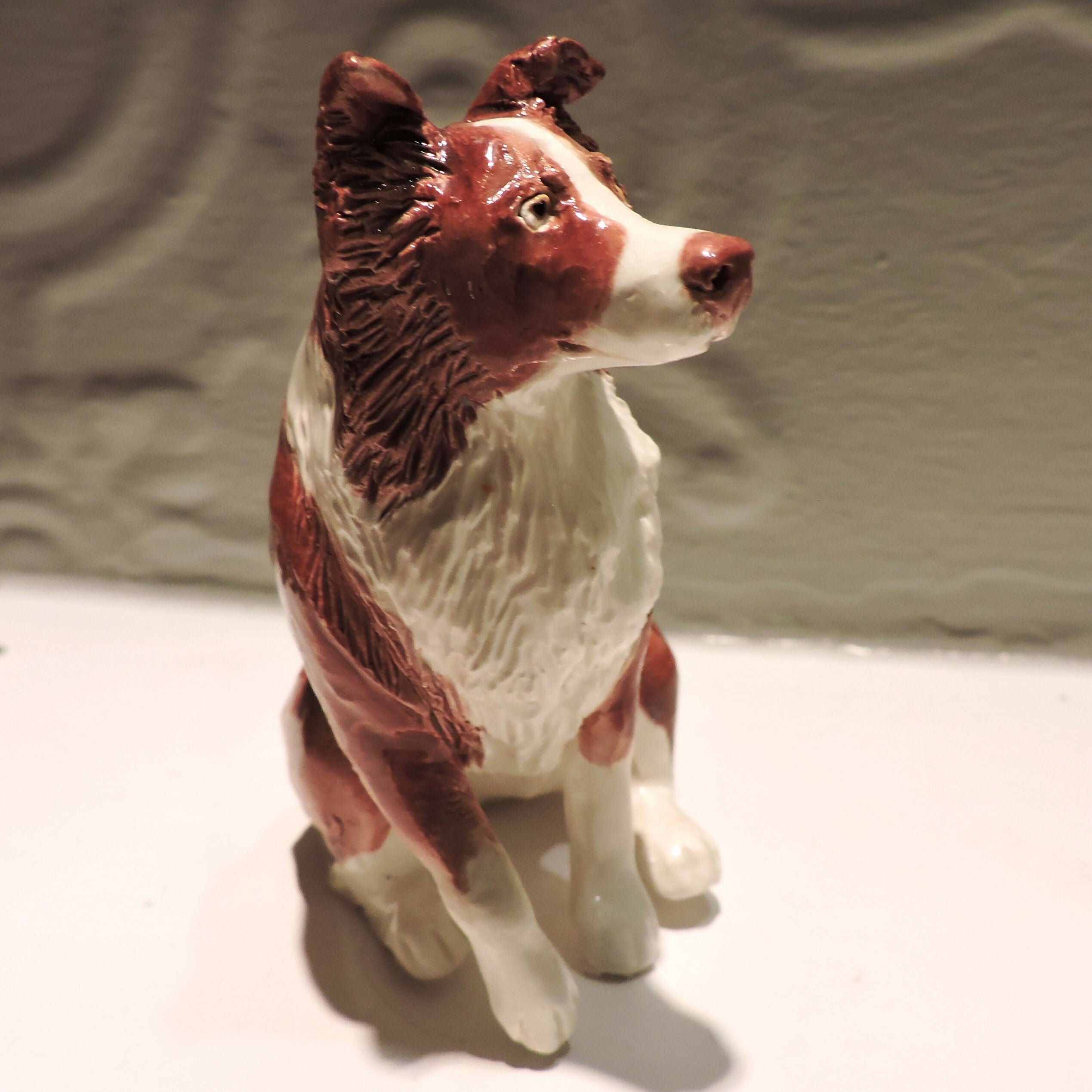 Ceramic border collie dog sculpture, red
