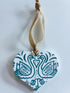 Hand-printed Wooden Heart Decoration with a Turquoise Swan Design.