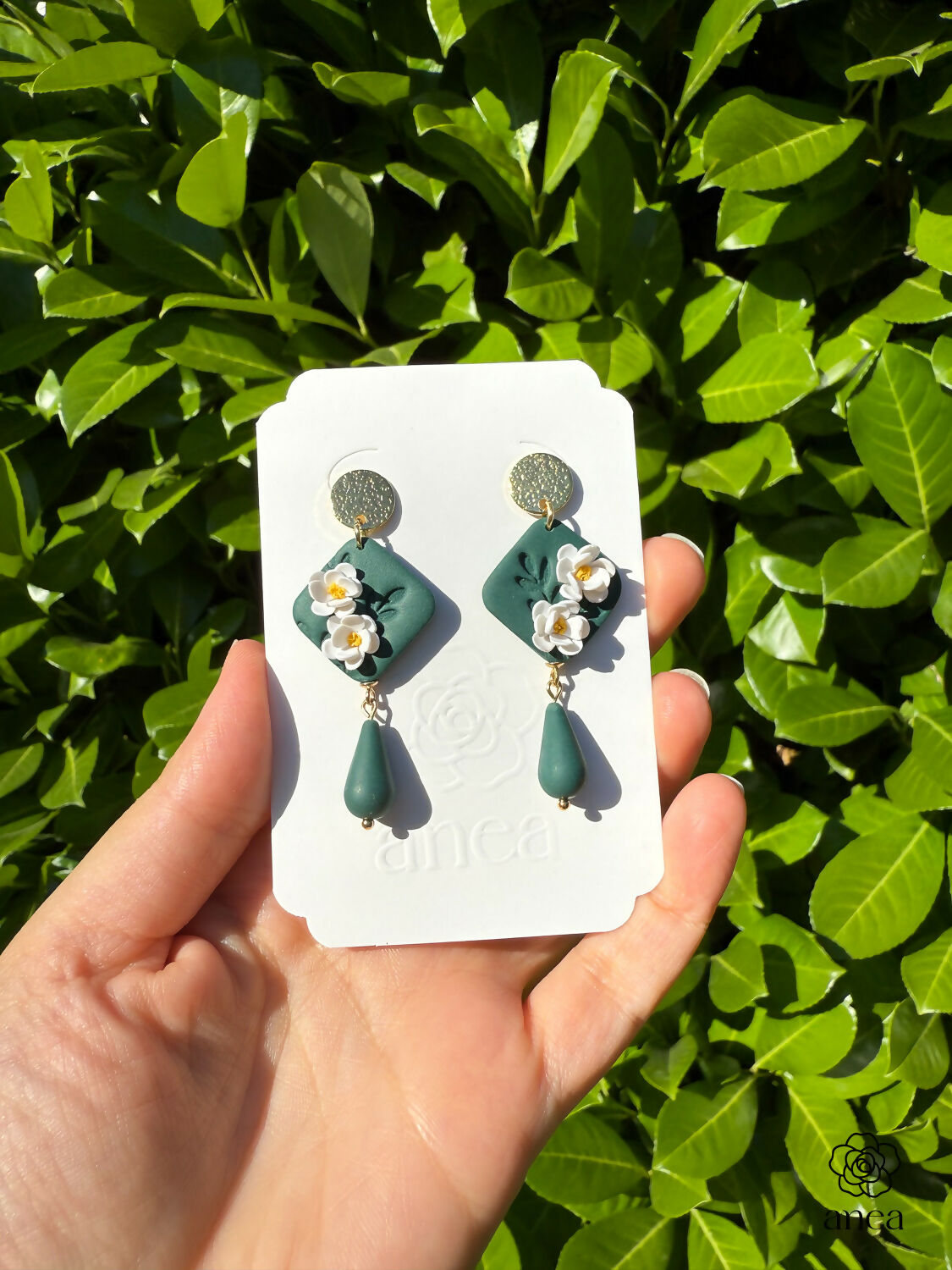 Green Floral Drop Earrings with White Blossoms and Gold Detail