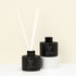 Reed Diffuser with black glass bottle and white reeds